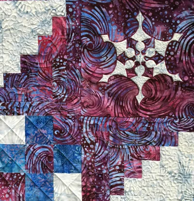 Frosty Frozen Wonder Quilt I , Snowflake corner block machine stitched. small stipple in reverse applique space and light fabric of log cabin border. cross-hatch in blocks. front view.
