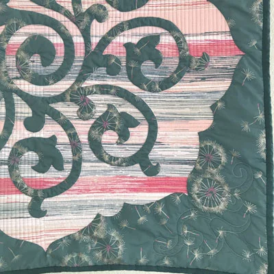 Whirlwind, Medallion VI . Close up of quilting, with a modern-style concept in the reverse applique space, and a corner motif.