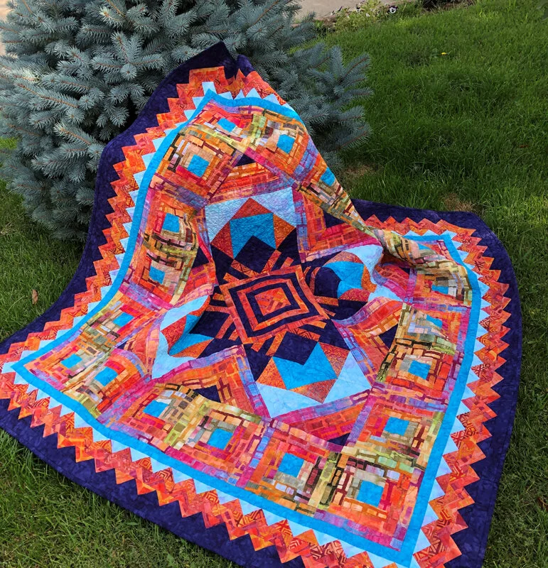 Ojo de Dios Quilt XVI (60” x 60”) for machine piecing and Paper-piecing. Our first NON reverse applique pattern.