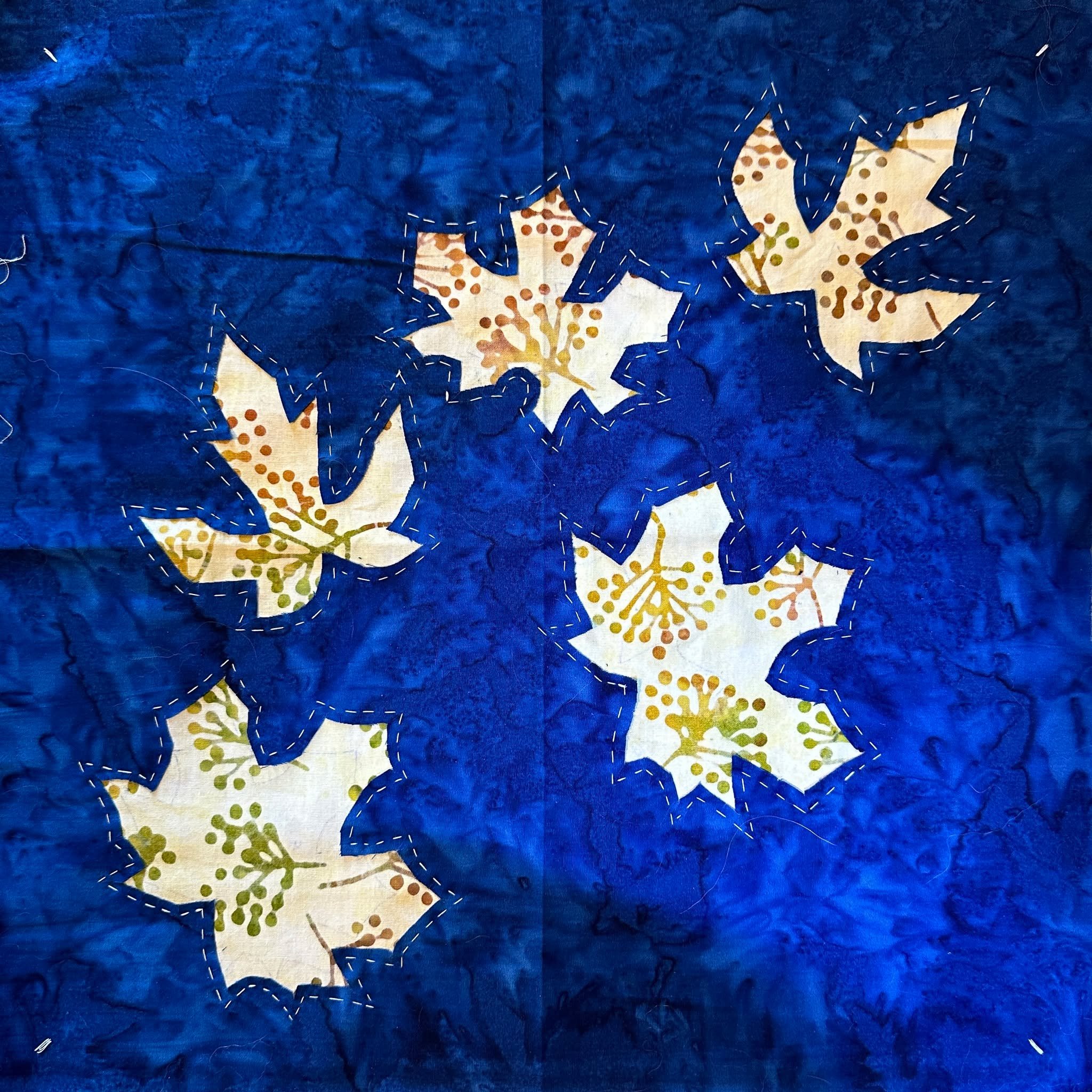 Stitching Reverse Applique with Appliqu&eacute;
🍁Creating the layered flurry of autumn leaves in this new original design.  Using my Trace, Baste, Snip &amp; Stitch method I first made a reverse appliqu&eacute; base of my block. (The pattern for eve