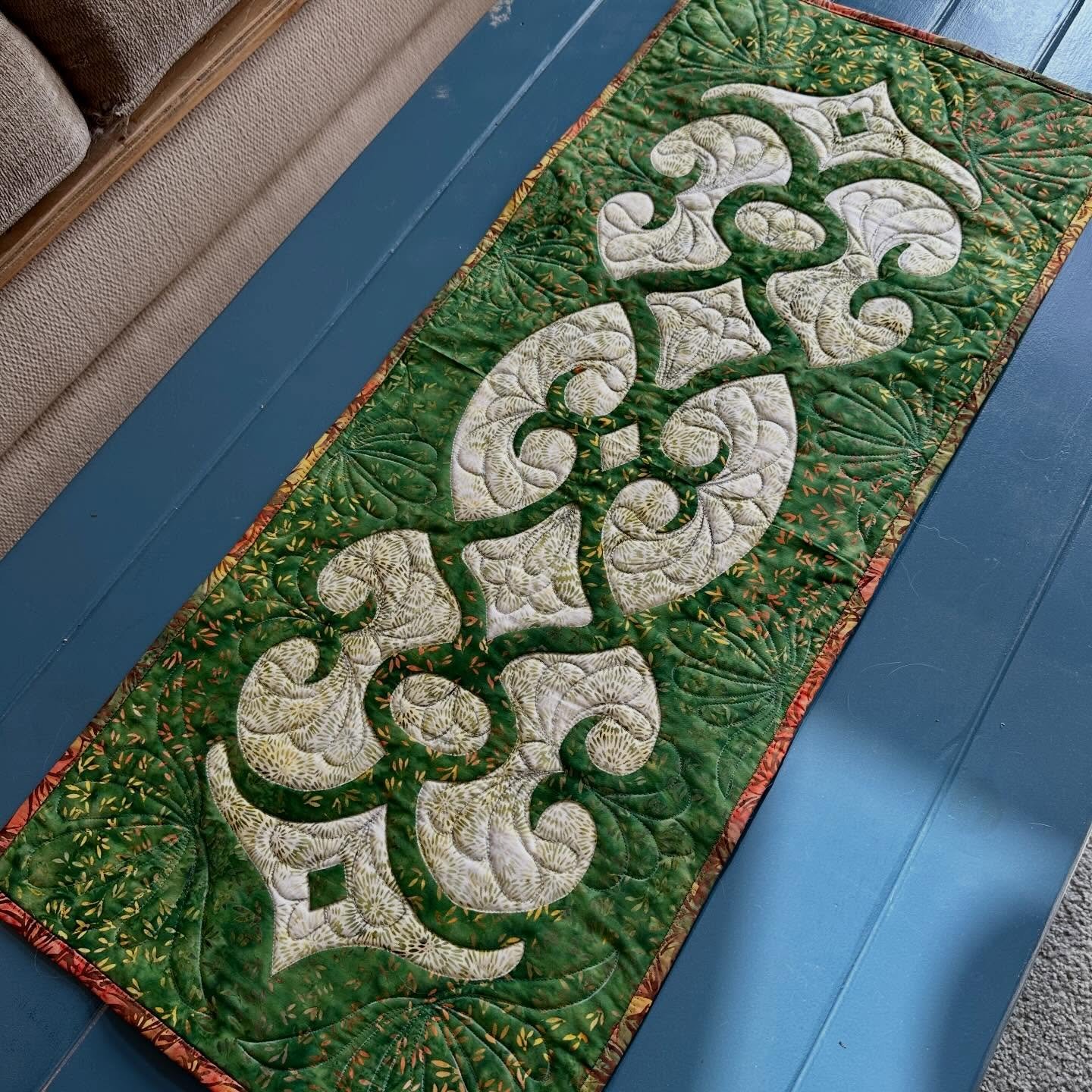 Going green.☘️ ENCHANTED EVENING table runner gets a new look. An ever popular pattern for beginning hand reverse appliqu&eacute;. Fabrics- batiks by @luminfabrics #reverseapplique #tablerunner #luminfabricsbatik #luminfabrics #eyeofthebeholderquiltd