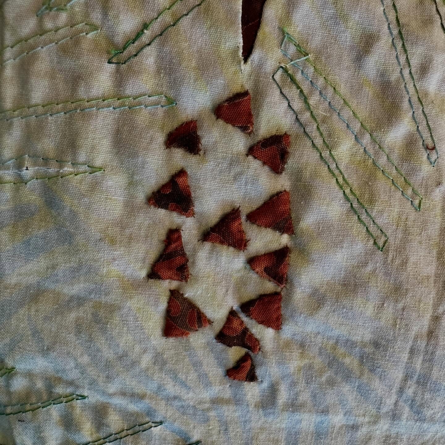 Stitching my pine cones, piece by joyous addition of a piece with trace, baste , snip &amp; stitch, the fun way to hand #applique . Pinecones are in my &ldquo;Chick-A-Dee&rdquo; project for the AQS SEAM quilt cruise to CANADA &amp; NEW ENGLAND I&rsqu