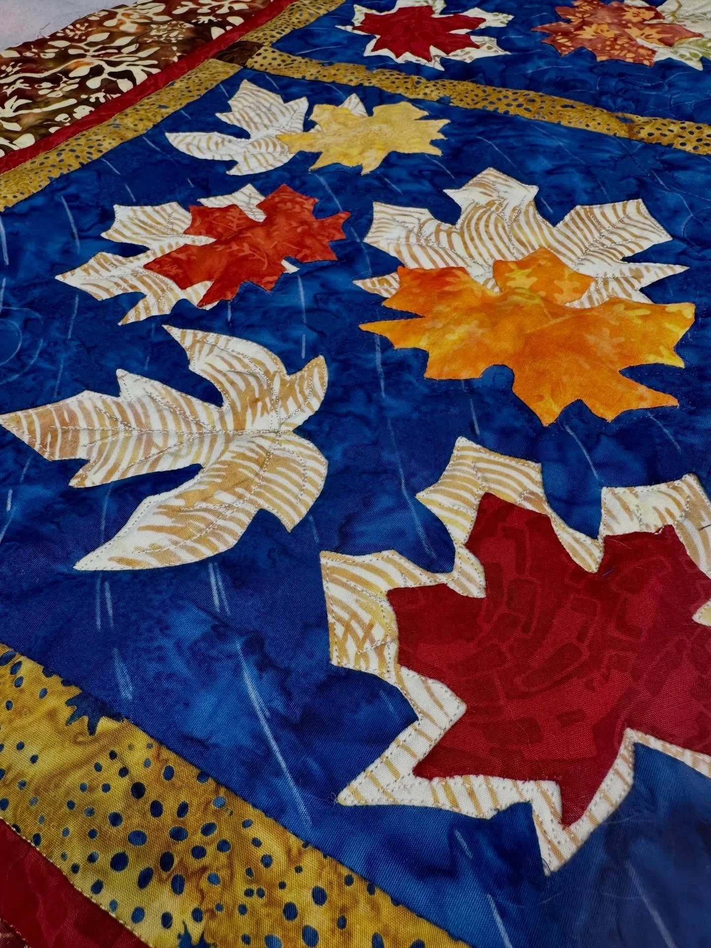 Autumn Window 🍁in process of being quilted. Love adding the ultimate dimension to a reverse appliqu&eacute; with appliqu&eacute; piece by quilting it!❤️ class project 2 on the AQS SEAM Quilt Cruise-CANADA &amp; NEW ENGLAND, September 18-25, 2027. Do