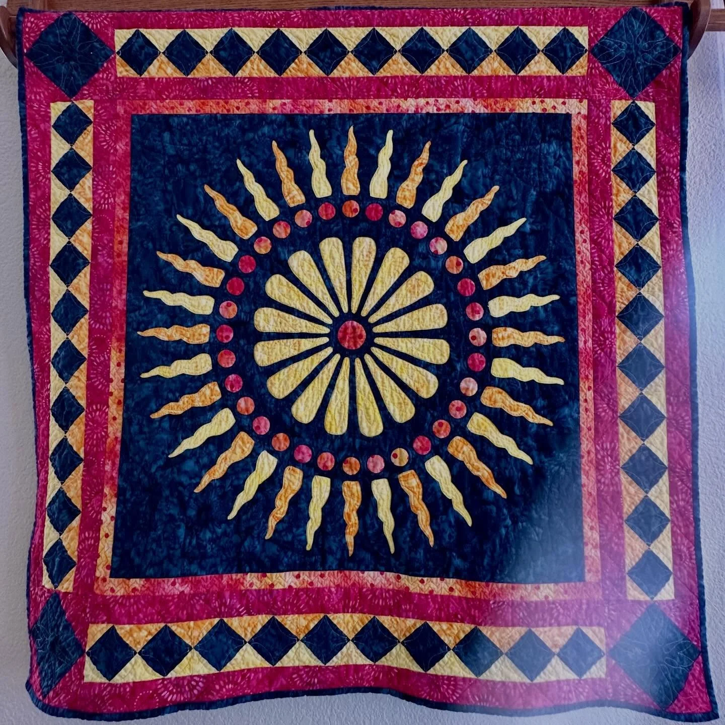 Glorious Medallion. Freshly washed and hung for Easter. Reverse appliqu&eacute; with appliqu&eacute; for hand or machine, in beautiful batiks by @batiktextiles . #reverseapplique #eyeofthebeholderquiltdesign #batiktextiles #happyeaster #medallionquil