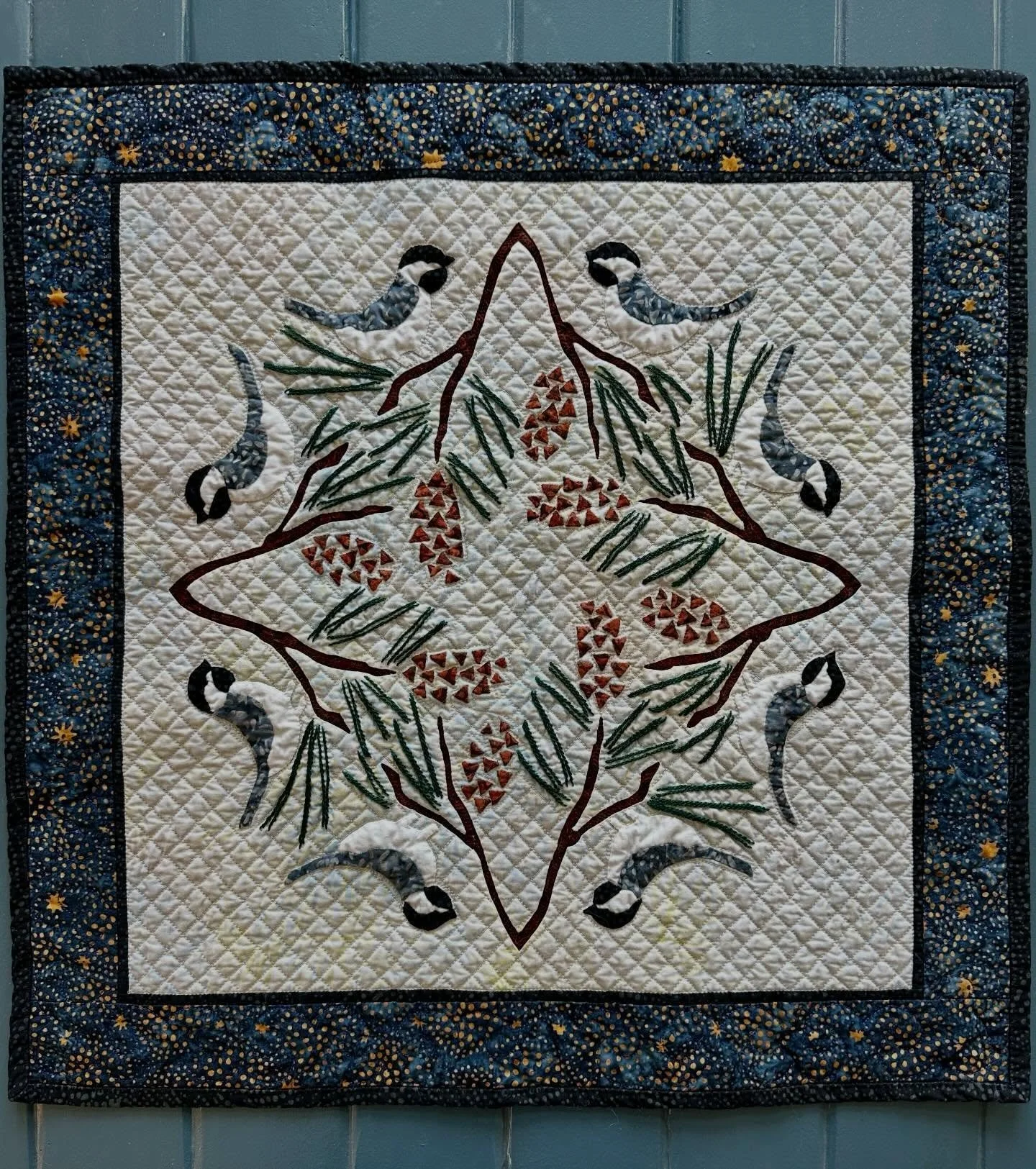 Sweet little chick-a-Dee-Dee-Des are done! Such fun dimensions: Reverse Applique branches, applique chick-a-dees and pine cones, embroidered pine needles! Class project 1 on AQS SEAM Quilt Cruise-CANADA &amp; NEW ENGLAND, September 18-25, 2027.sign u