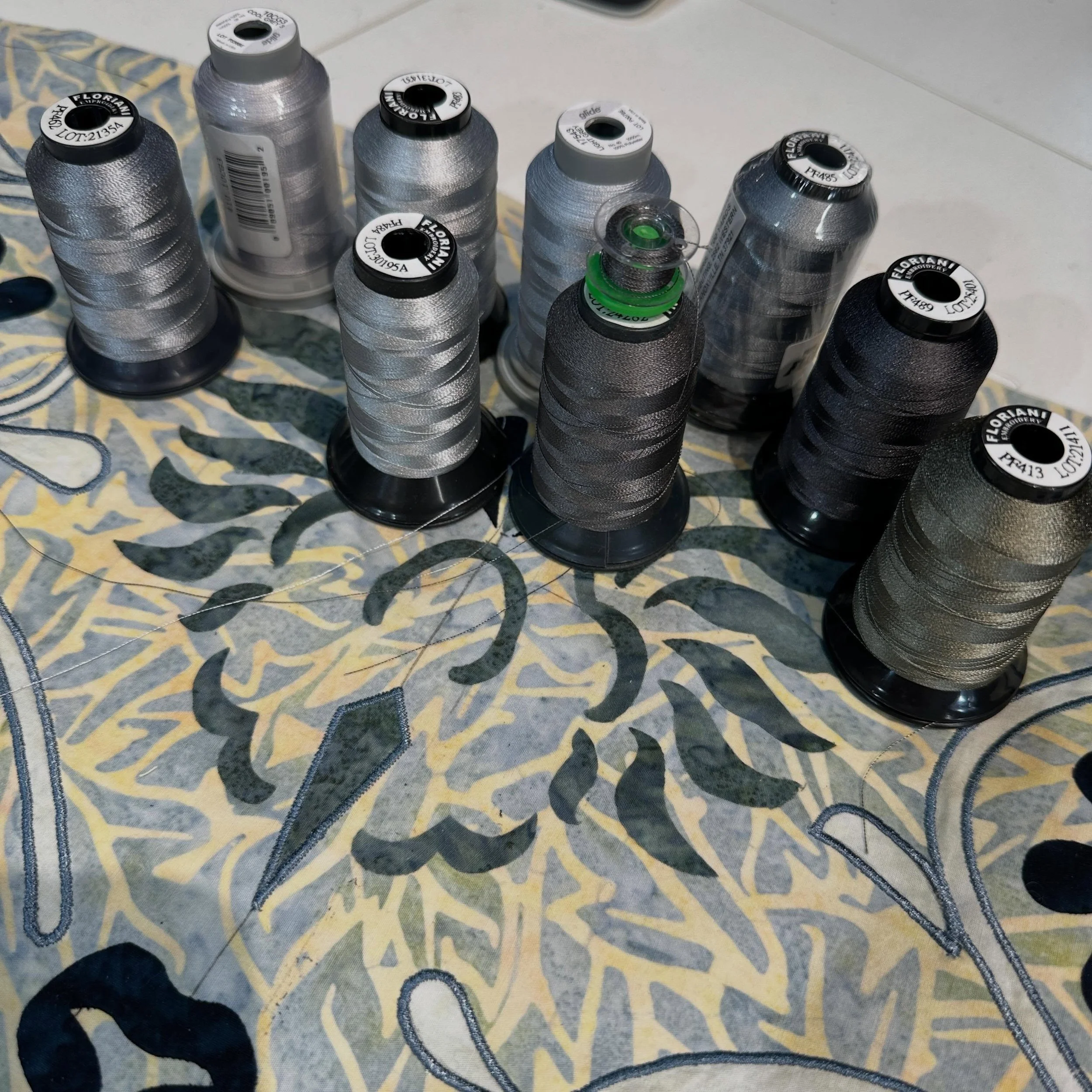 Hard to believe&hellip;. Of all these grey threads I own (and I own more) none of them is a match to my grey fabric I need to machine appliqu&eacute;; it&rsquo;s a green based grey. One is passable. Have another to try that&rsquo;s quite green. Other