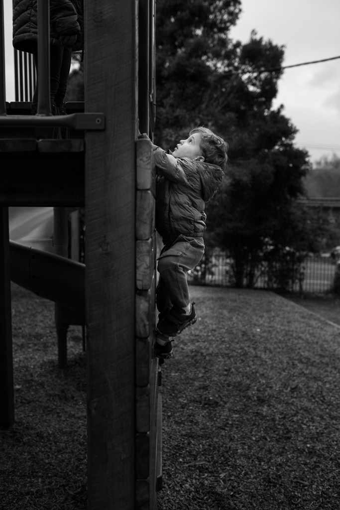 family photos - boy climbing in park