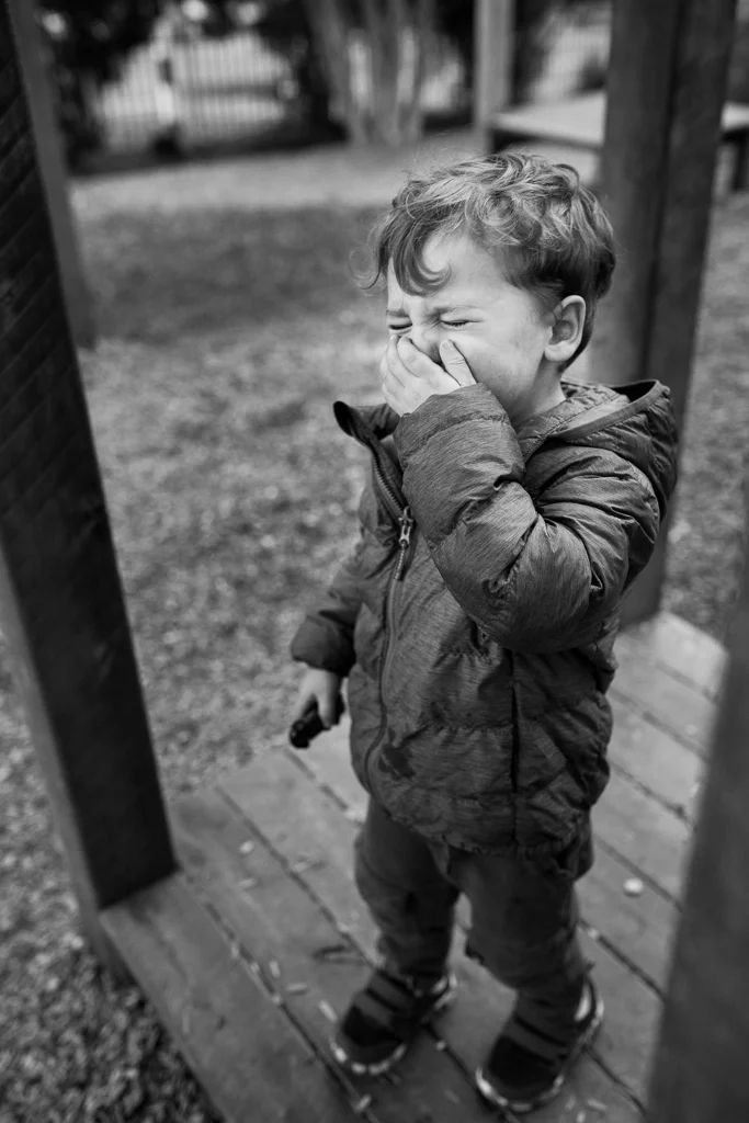 boy crying in park