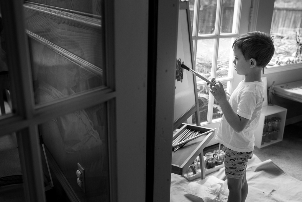 family photography - mom watching son paint