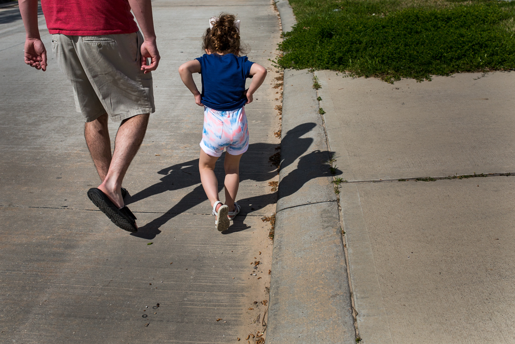 girl walking with dad