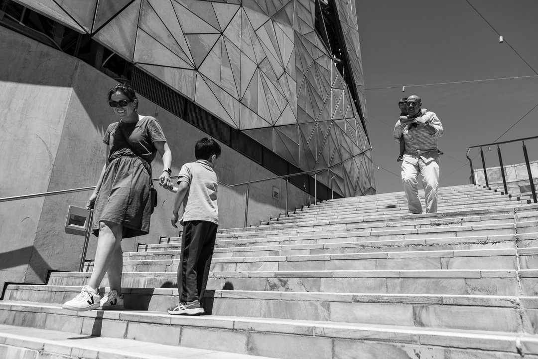 photo shoot family - walking down steps at federation square