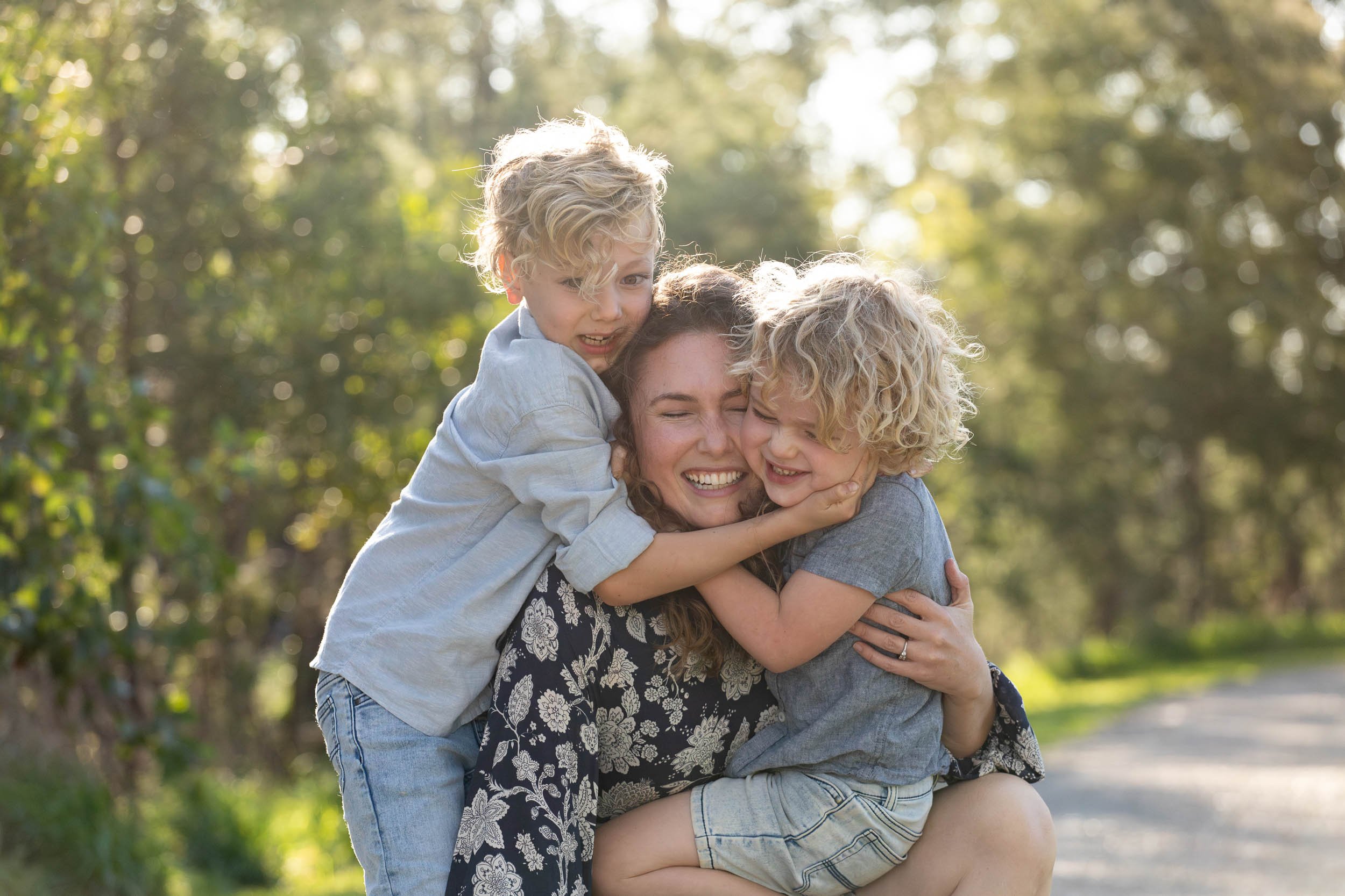  family photograph boys hugging mum in melbourne park 