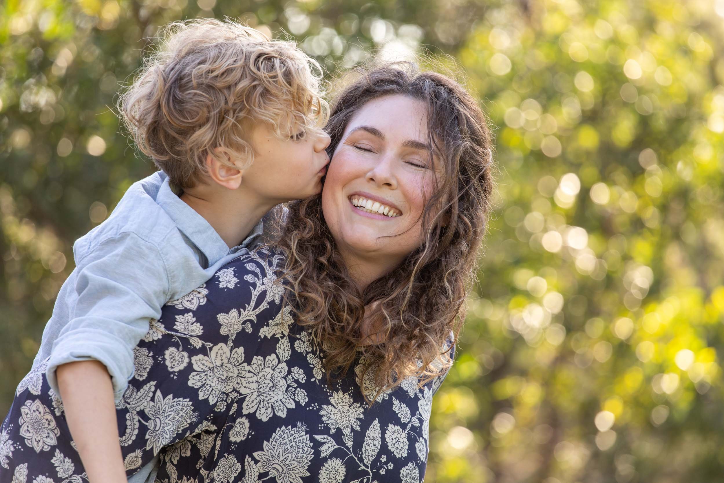  family photography mum with boy kissing cheek 