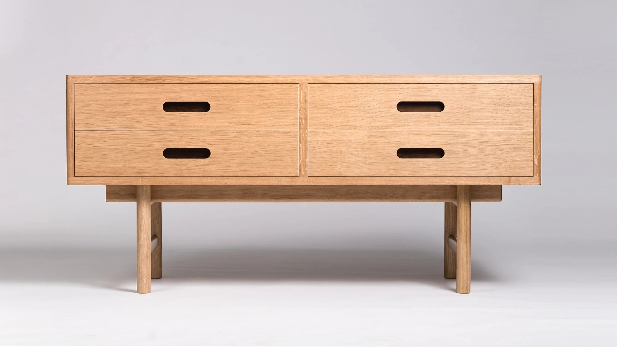 bespoke oak low cabinet with four drawers  and recessed handles