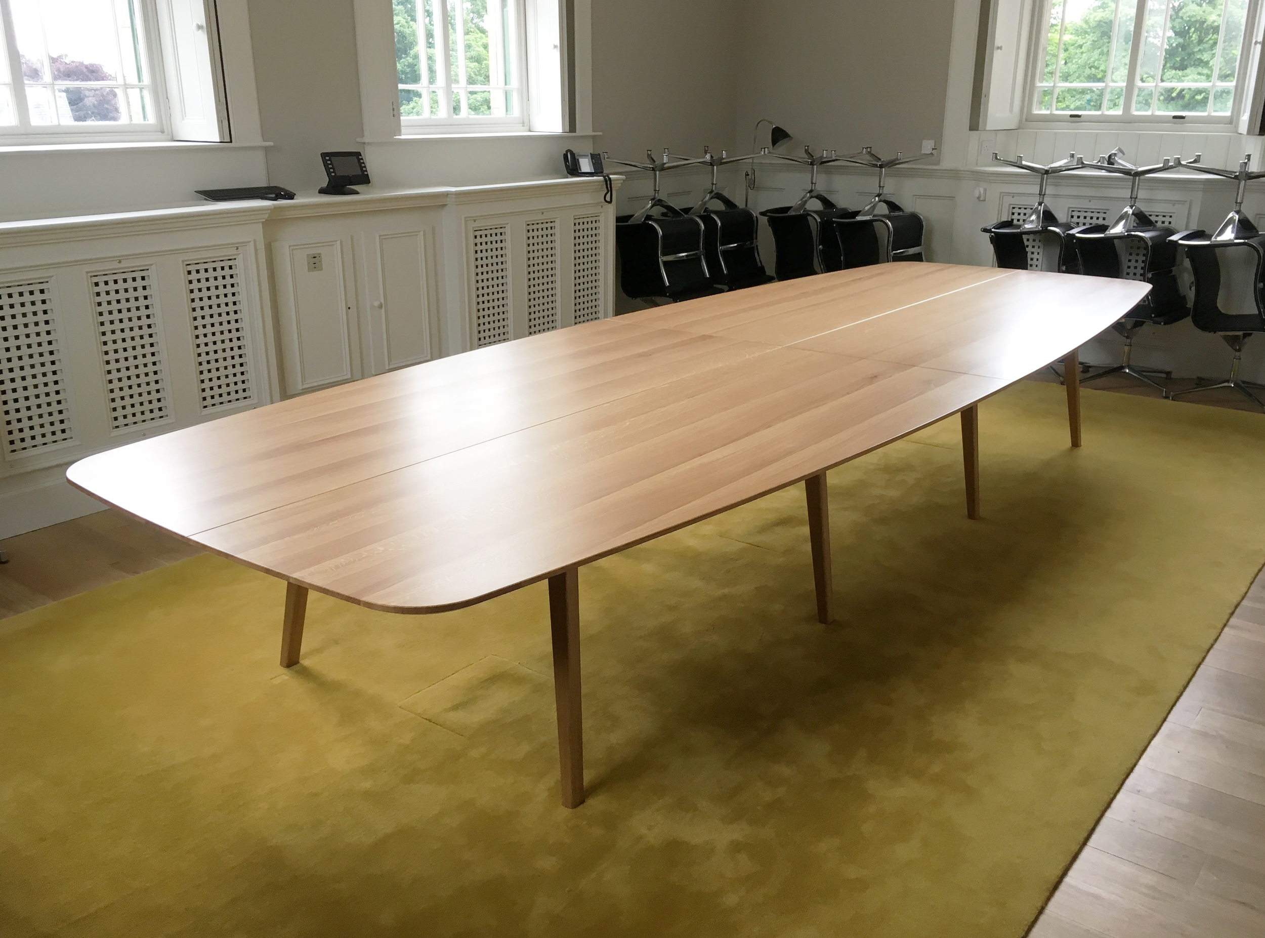 Bespoke commission for large boardroom table hand crafted in oak by furniture designer and maker Namon Gaston