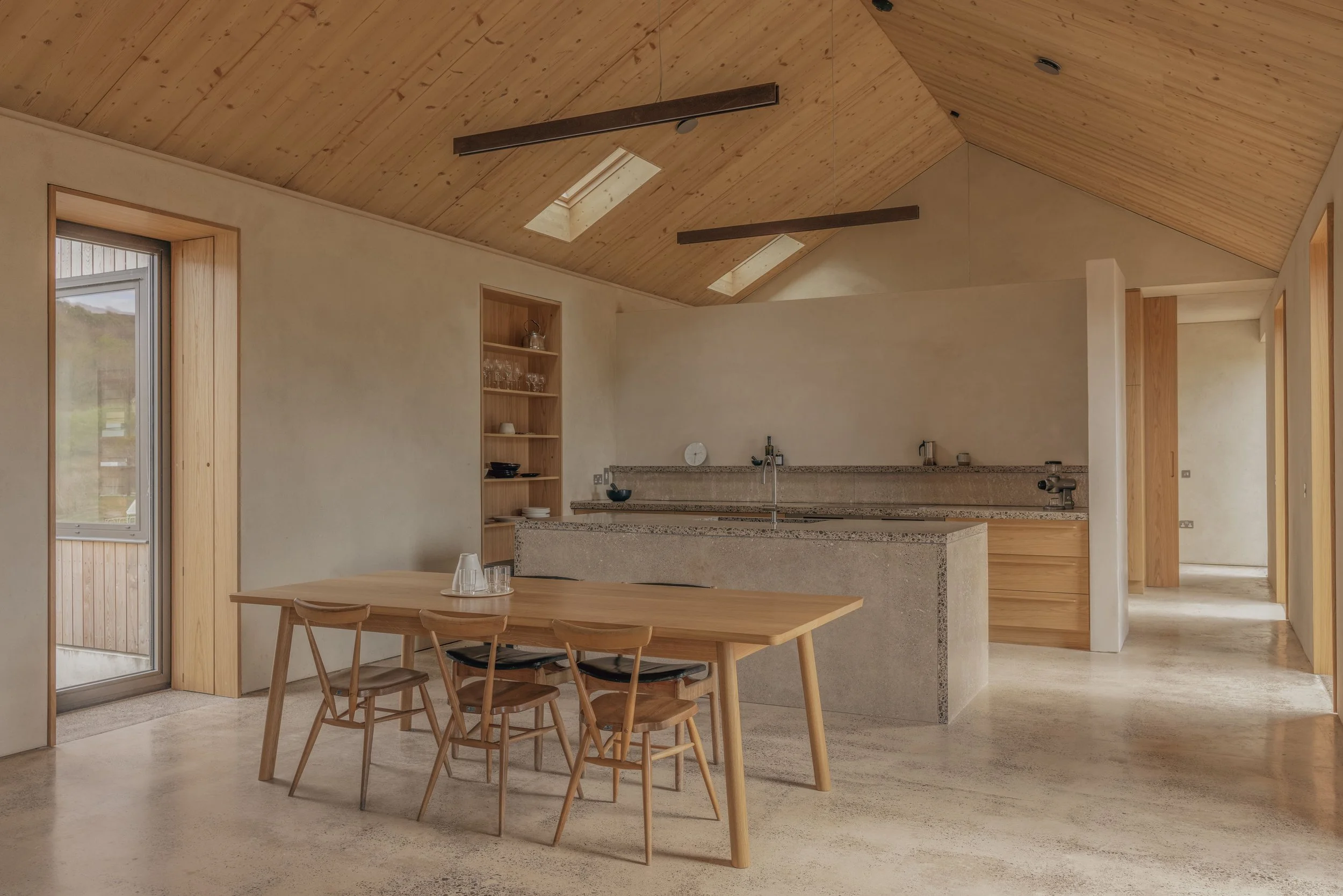 timber plaster interior with bespoke oak dining table