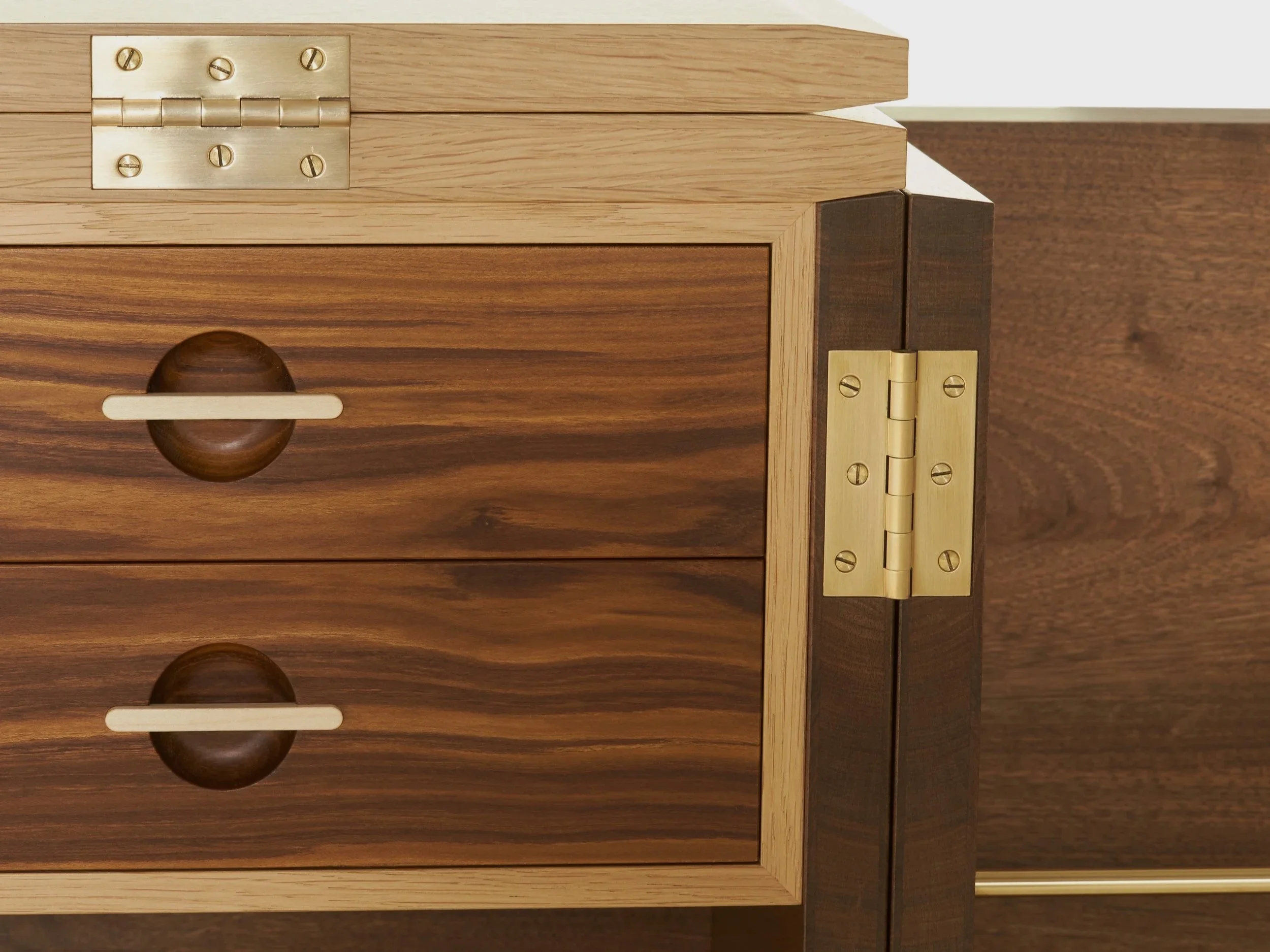 close up of handmade whisky cabinet, brass fixtures,  made from scottich walnut with scottish oak