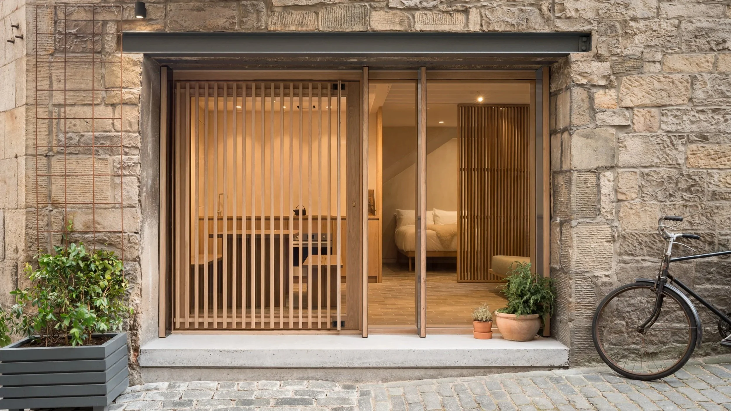 entrance to studio with bespoke timber stutters