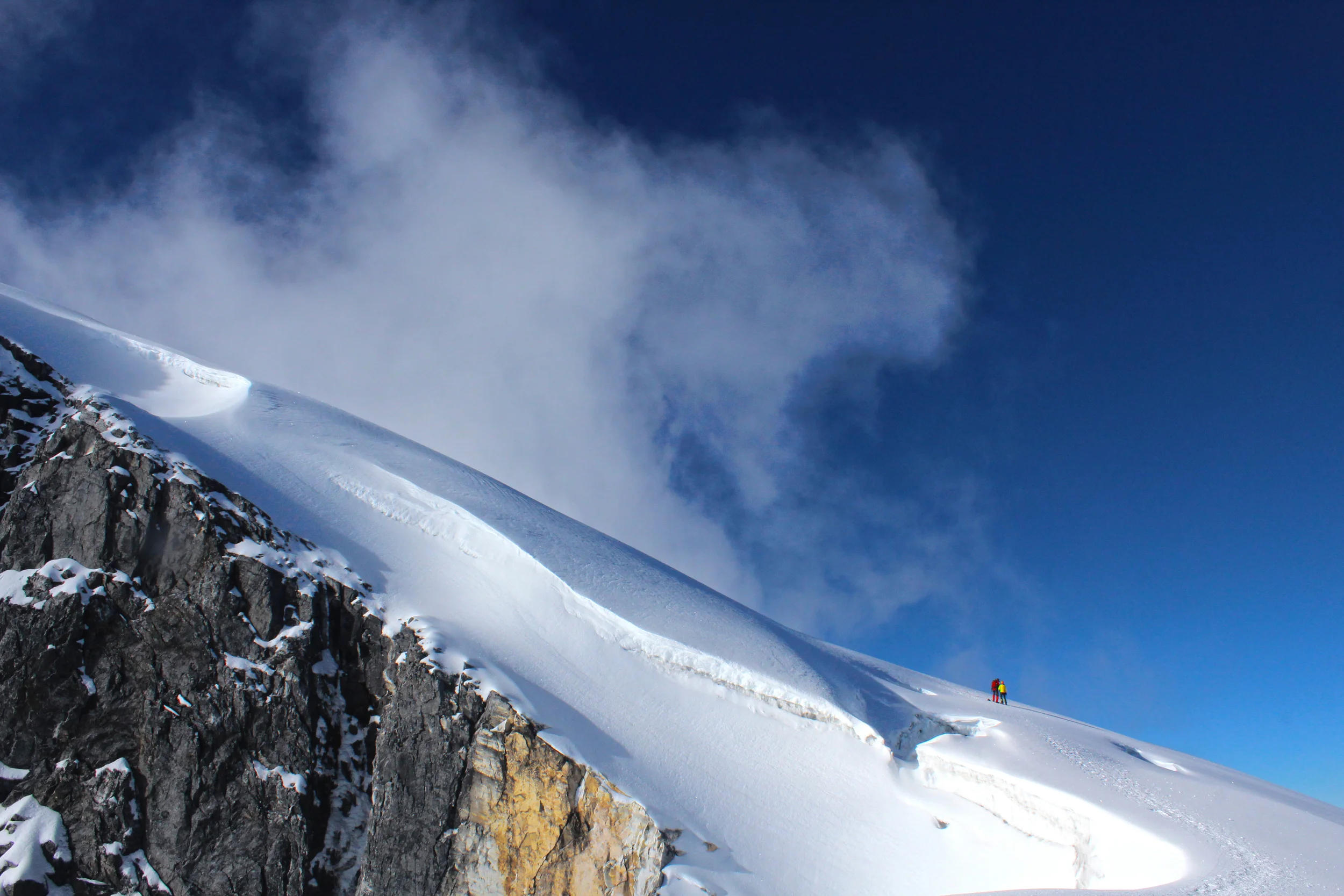 Climbers heading up the final snow slope to the summit.