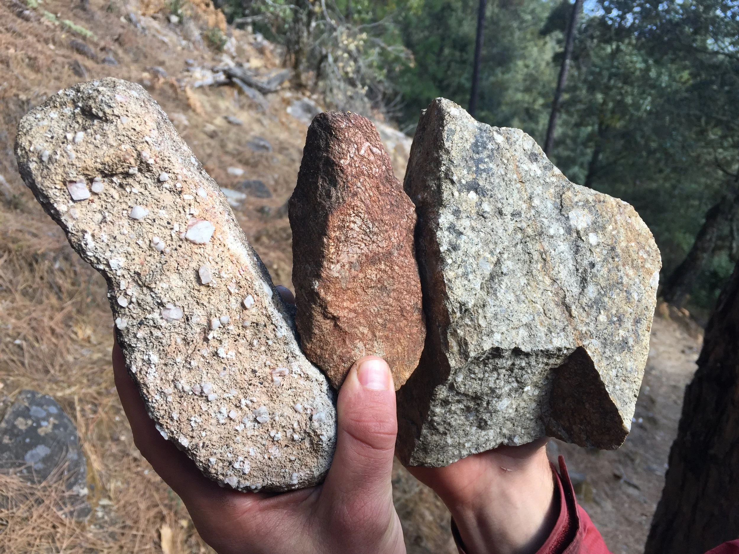 The variety of rocks found in the boulder field at the base of the wall. After some sleuthing on the Internet, we found a geologic map of Yunnan labeling the area as “Porphytic Granite Rock.”