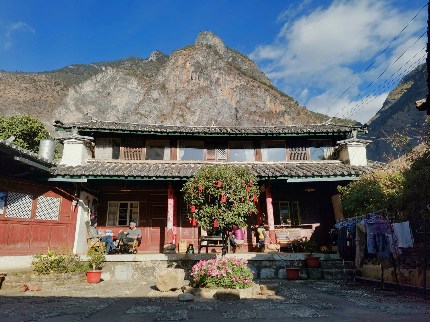 A view of just part of the comfy, homey courtyard climbers’ hostel, The Stone Drum House, started by husband and wife team Reuben Greenbank and Ling Zhang along with their young son, Ashleigh. The guesthouse is nestled in a mountainous valley up in …
