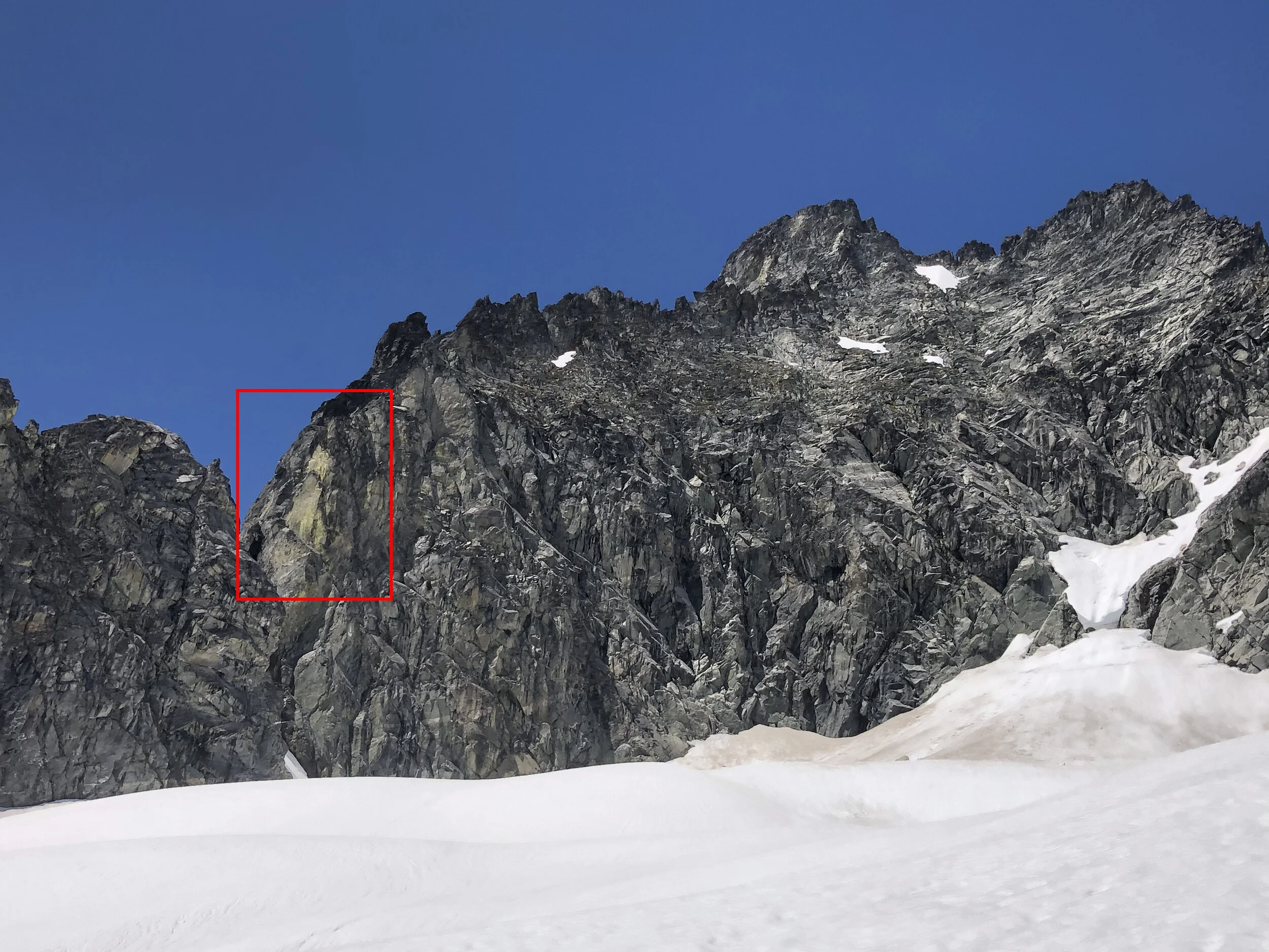 The yellow lichen on the headwall that above the notch that provides access to the South Ridge of Mount Torment