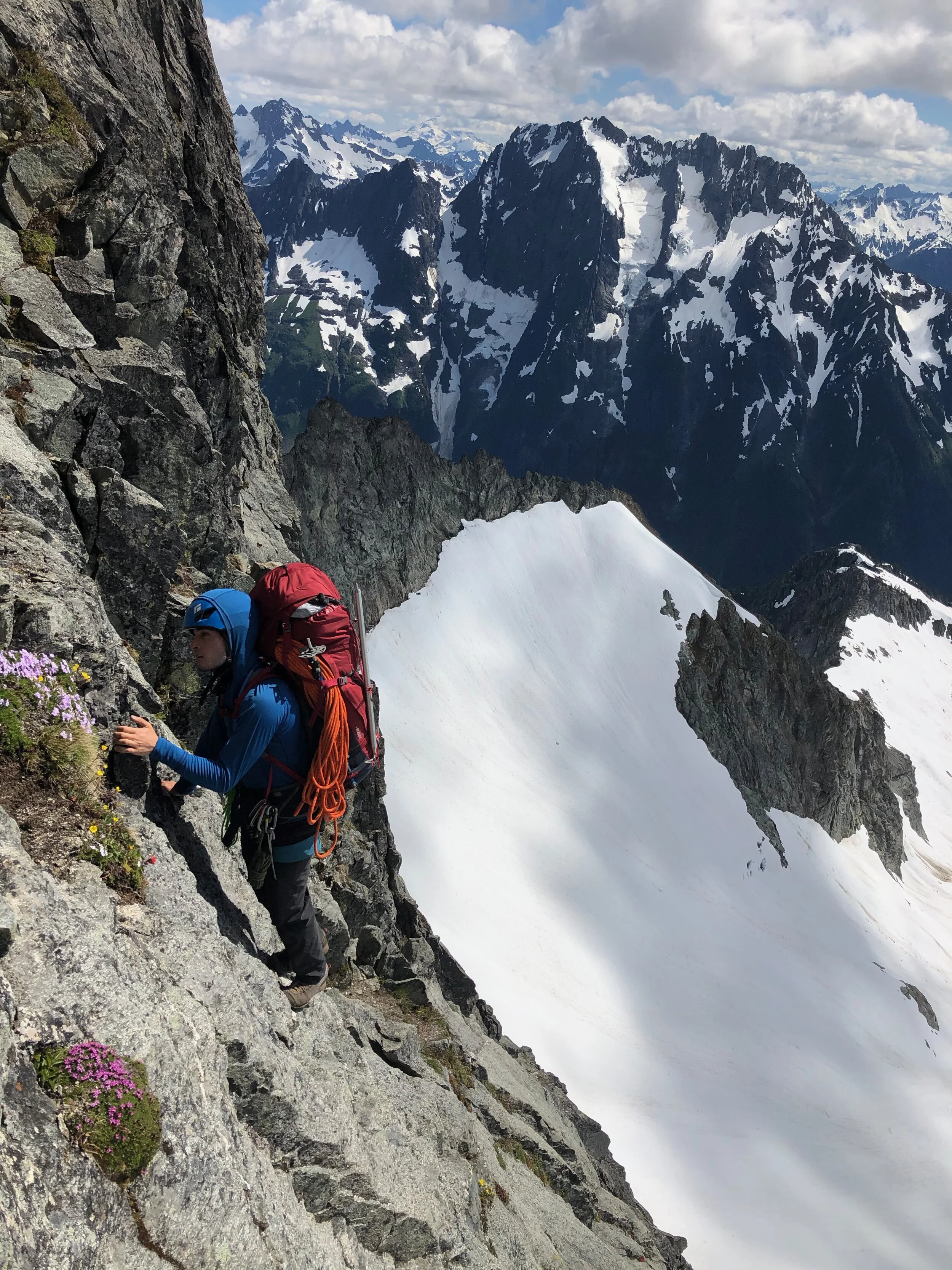 Woody climbs through some exposure on the South Ridge of Mount Torment.