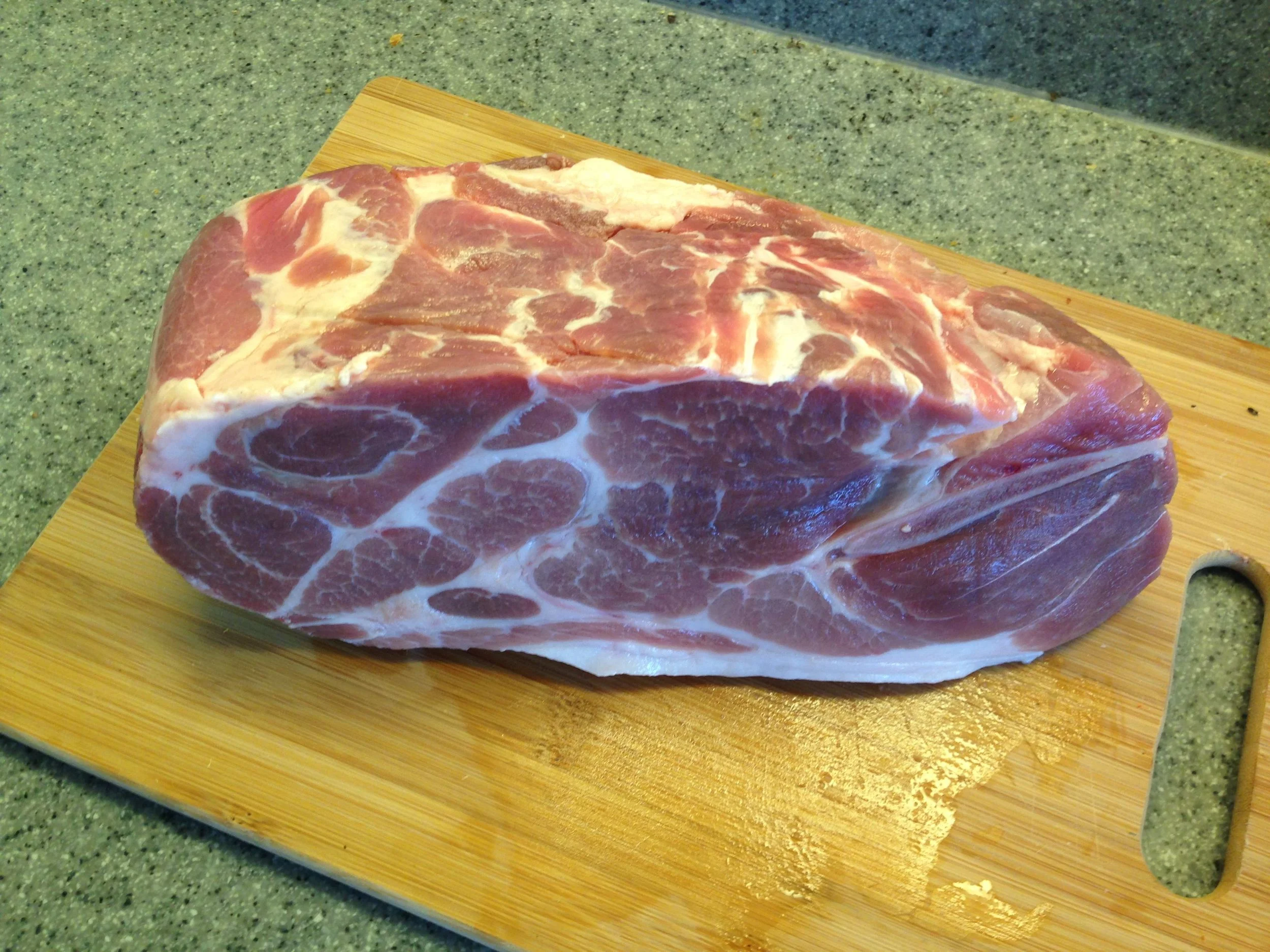 A 3 1/2 pound bone-in pork butt. About three inches thick.