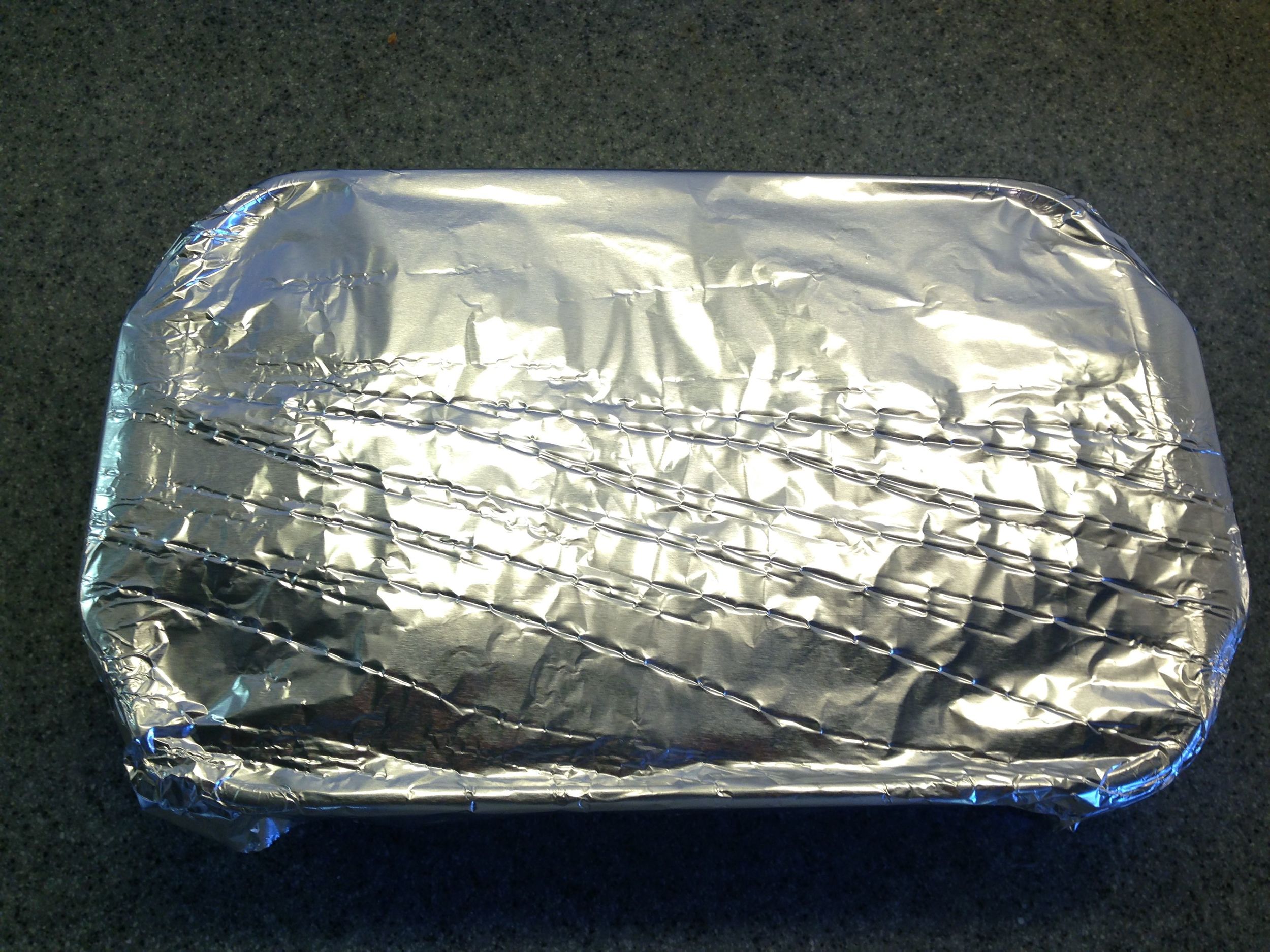 Wrap tightly with foil. The point here is to steam the meat.