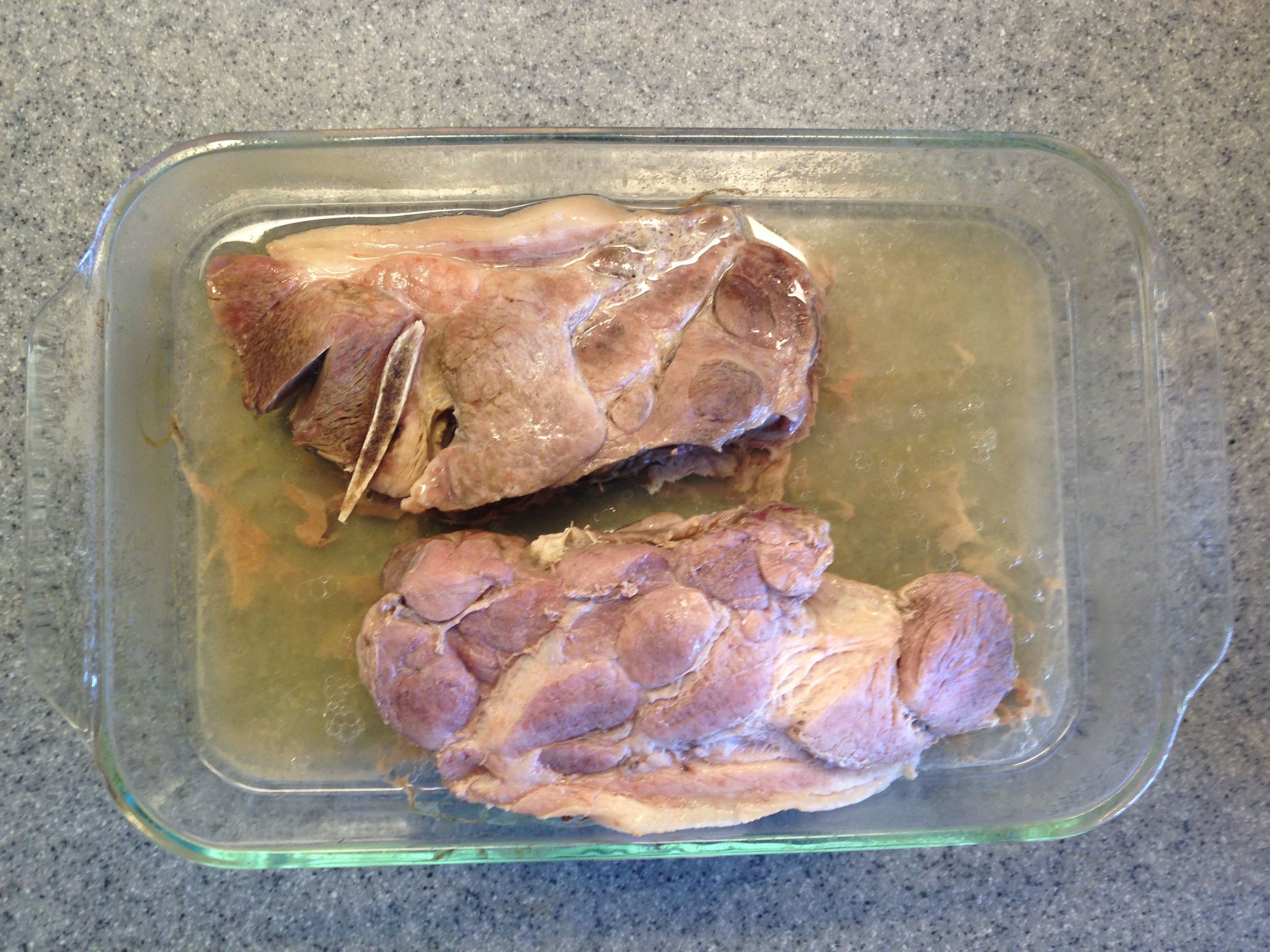 After an hour, remove the foil. The meat will look pale.