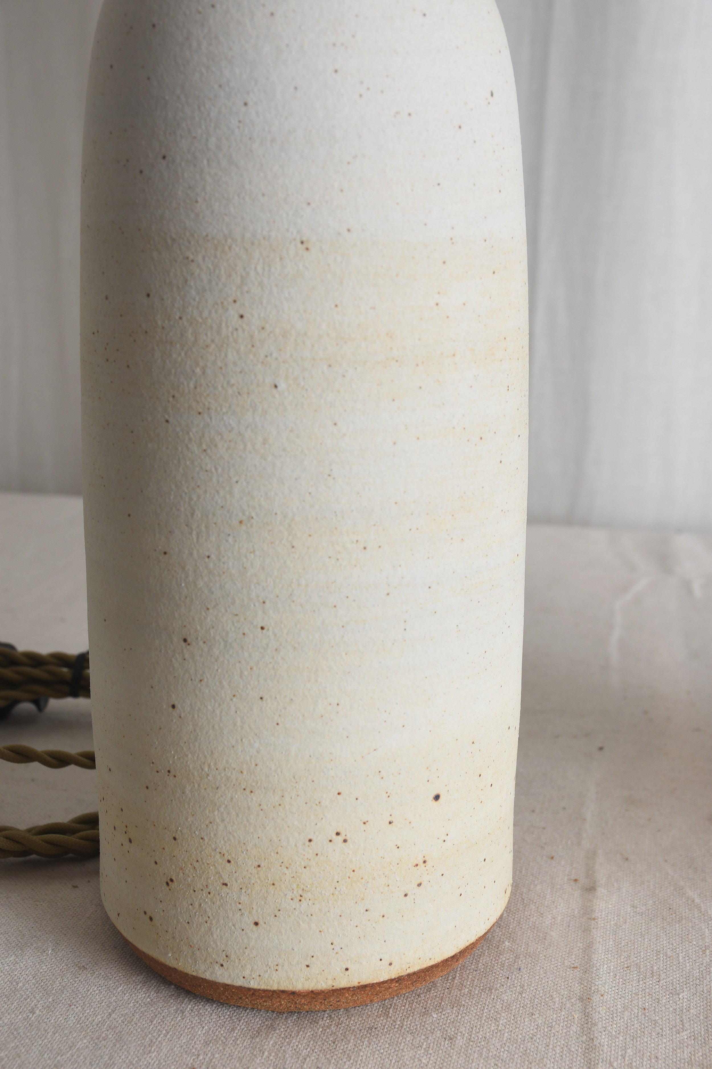 tall matte sand bottle lamps deet.jpg
