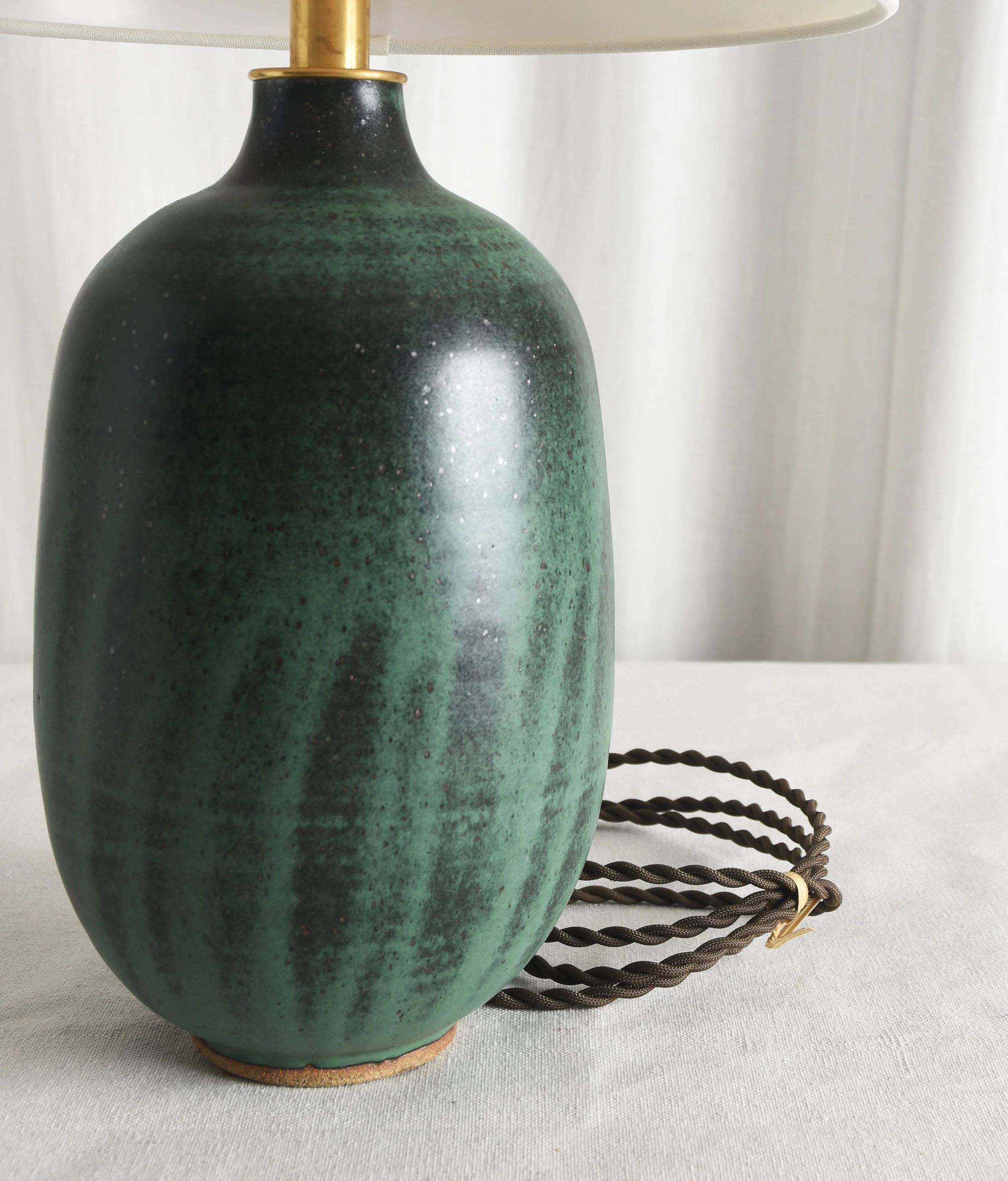 striated satin green black rounded bottle lamp deet.jpg