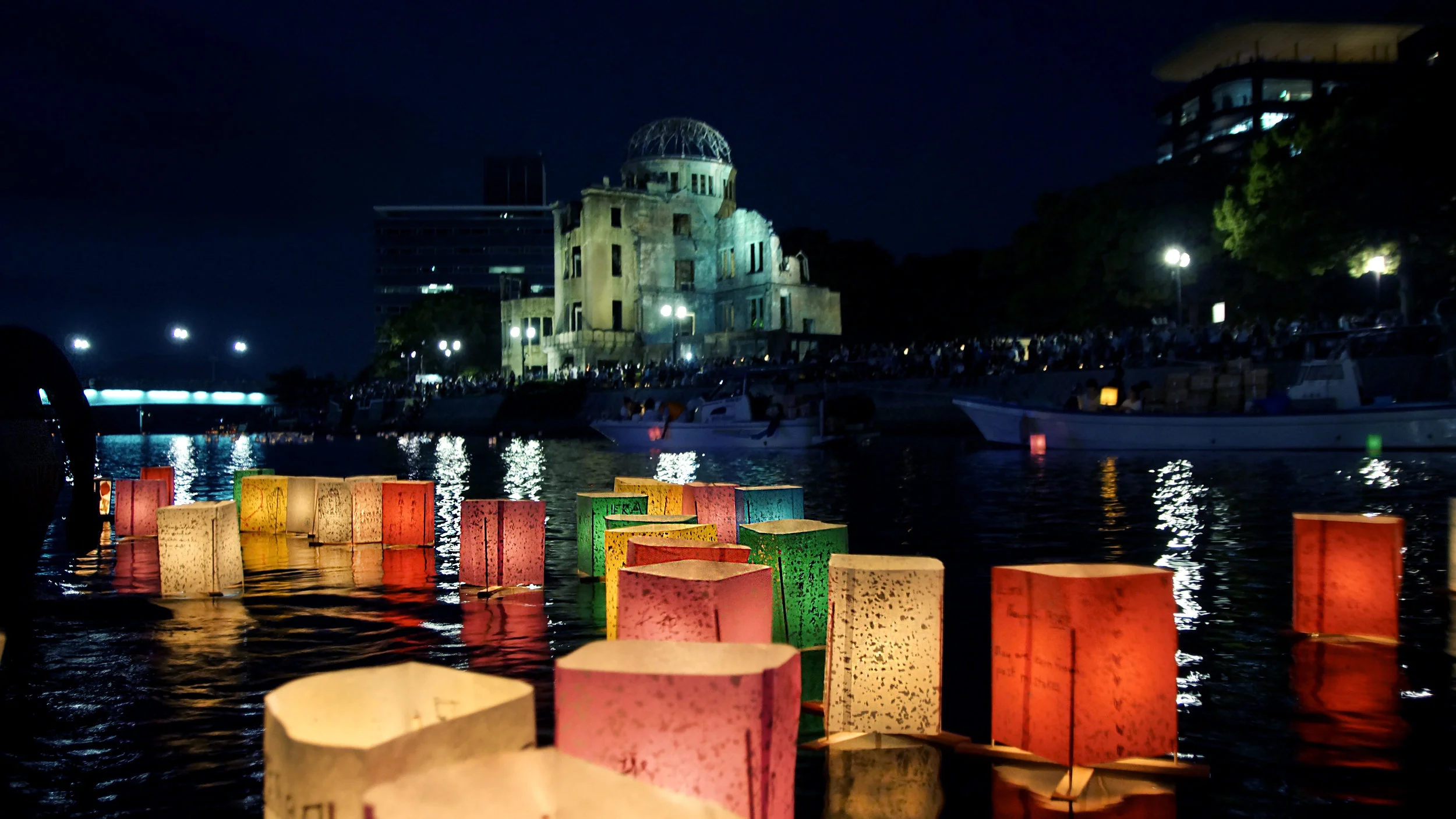 Motoyasu River Remembering the atom bomb in Hiroshima. The ceremony, known as Toro Nagashi involves releasing floating lanterns in Motoyasu River. Thousands of relatives and visitors gather near the Peace Dome, to remember the lives that perished in this very place 73 years ago. #japan #hiroshima #peacedome