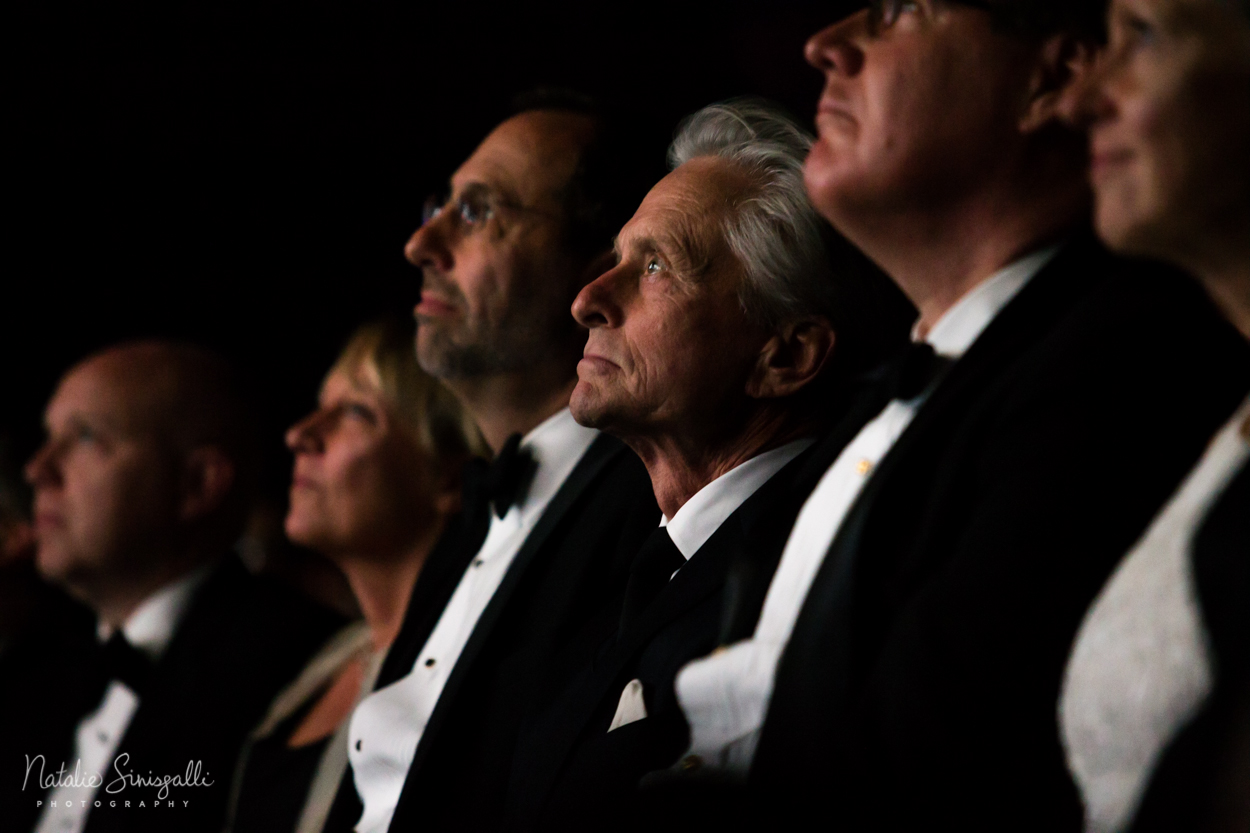 Michael Douglas watching highlight reel of his prolific career in Eastman's historic Dryden Theater