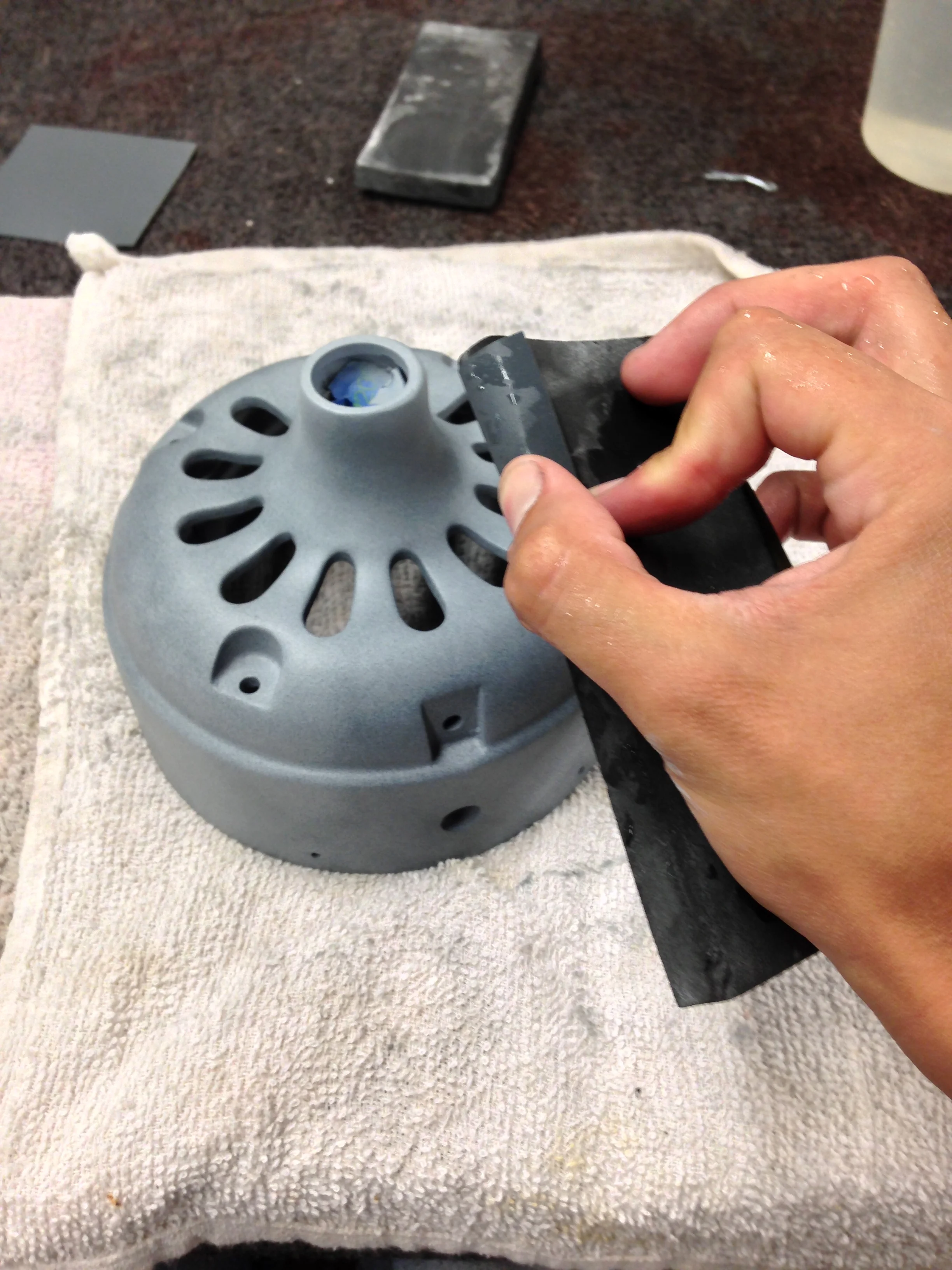 Figure 1: Sand paper wrapped around a soft foam sanding pad