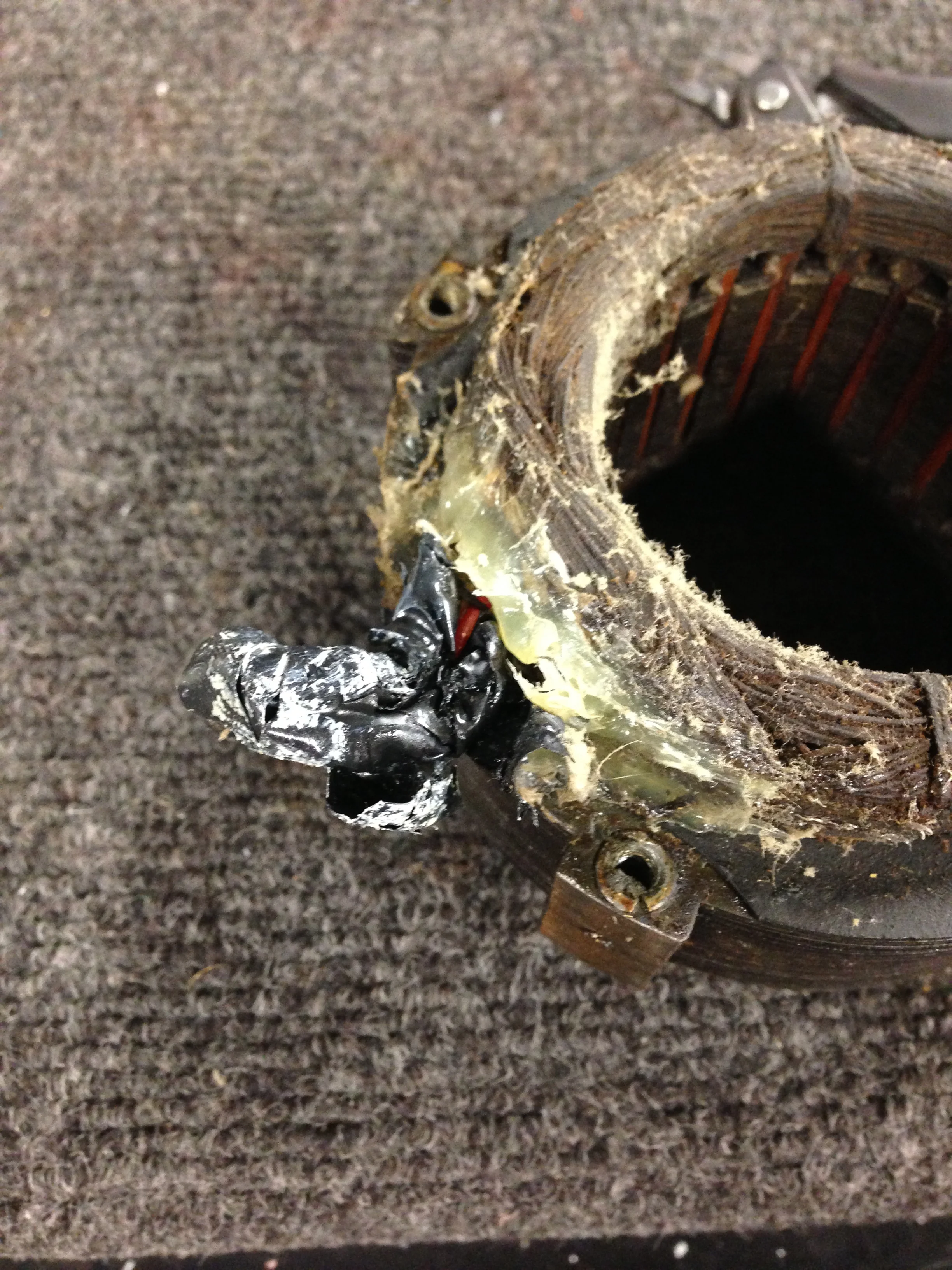 And here's the beauty that lies beneath the duct tape. This is electrical tape. Fine if you're re-wiring a lamp but I would never use this on a professional restoration.