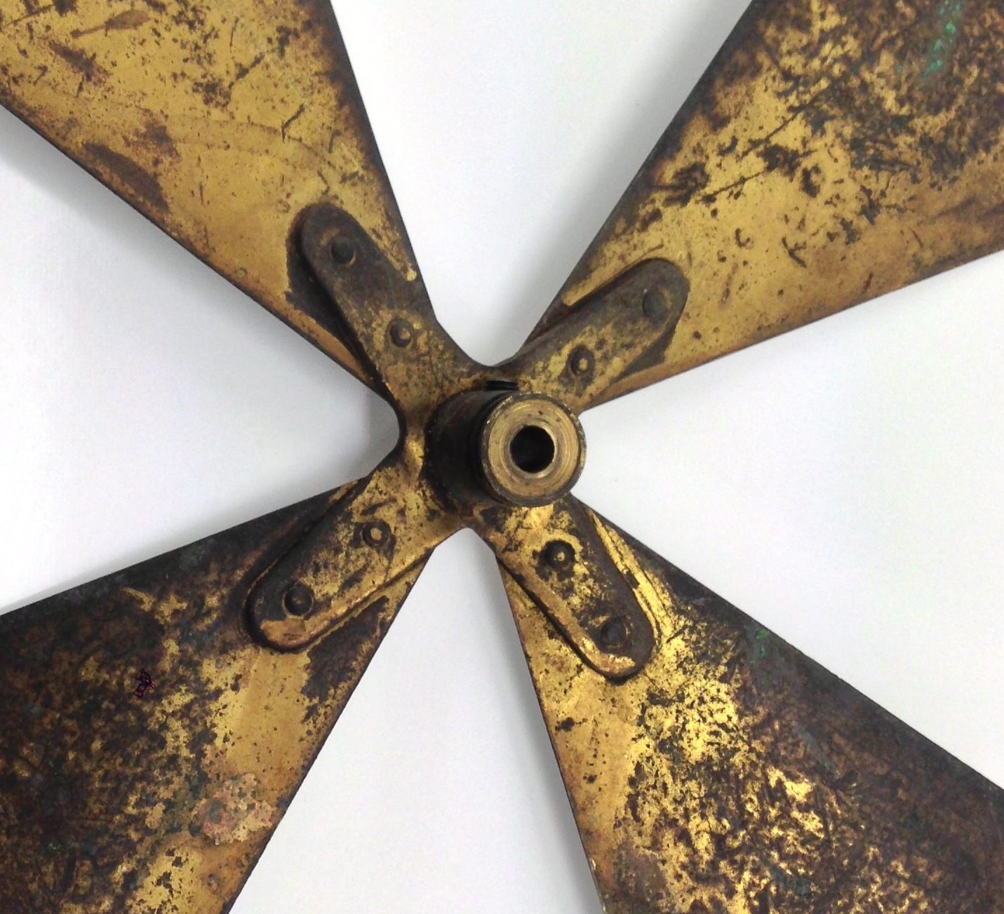 GE used (as did many) stamped brass blade hubs. This made bending them back into position a very simple task.