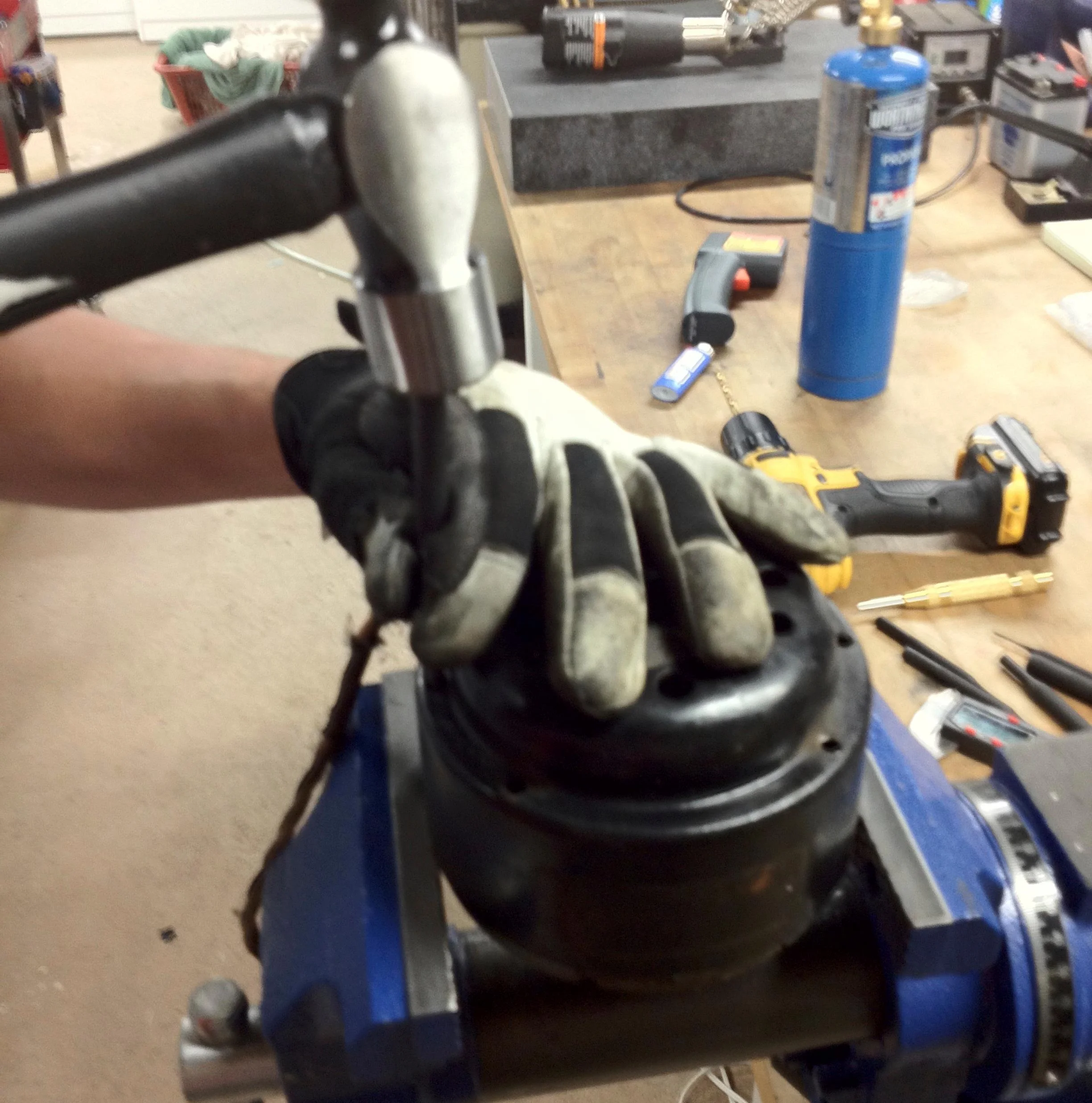 Using a punch and hammer gently punch the motor out from the holes that you drilled.