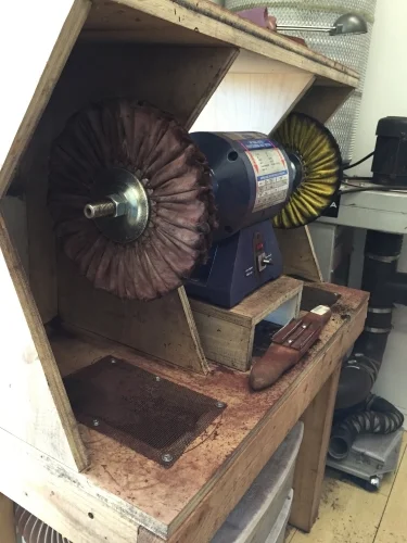 Here you can see that the cabinet would benefit from moving the buffer back a little, to allow the front of the wheel to be more centered over the intake duct. This would catch more lint.