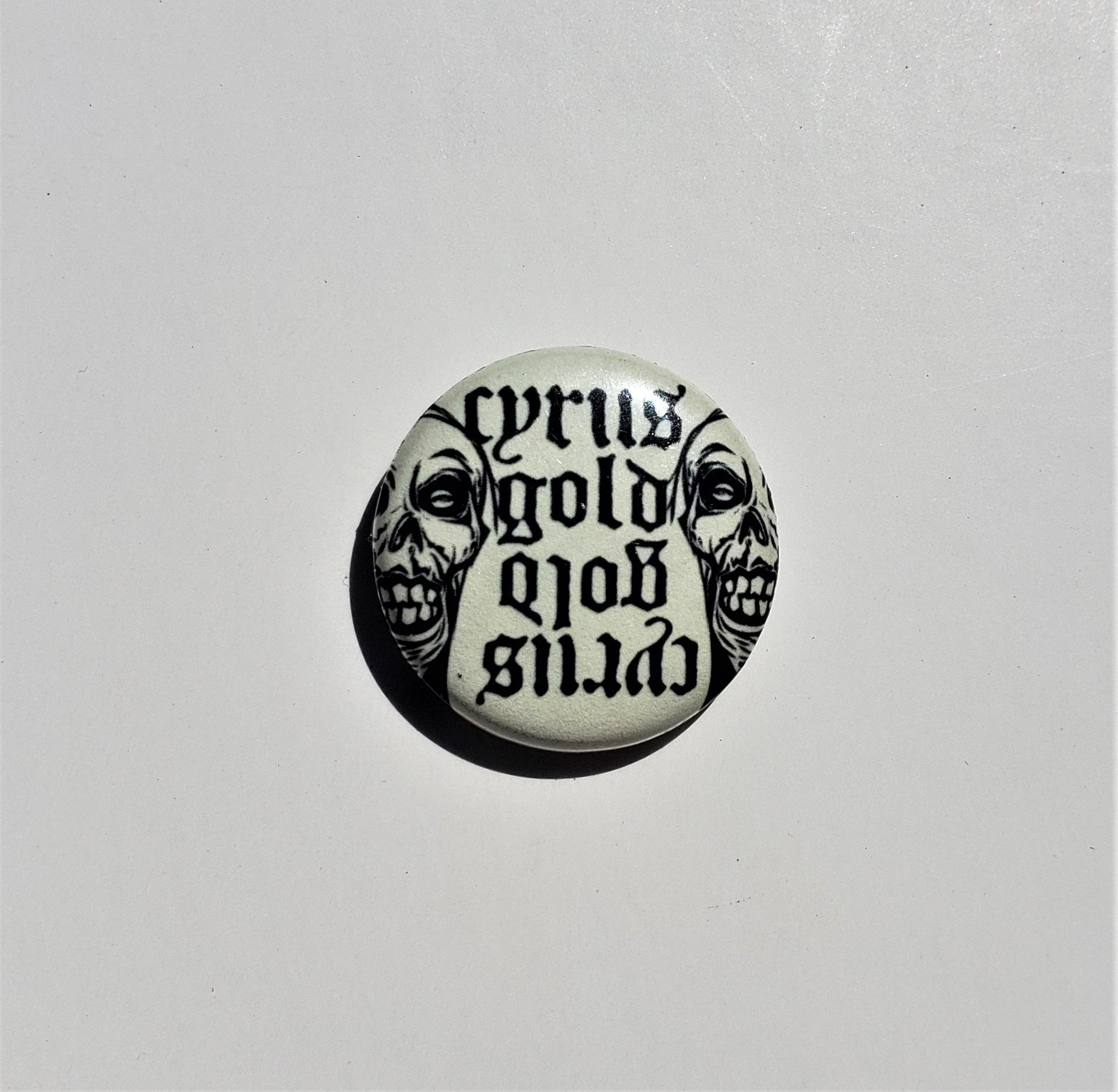 cyrus gold pin.jpg