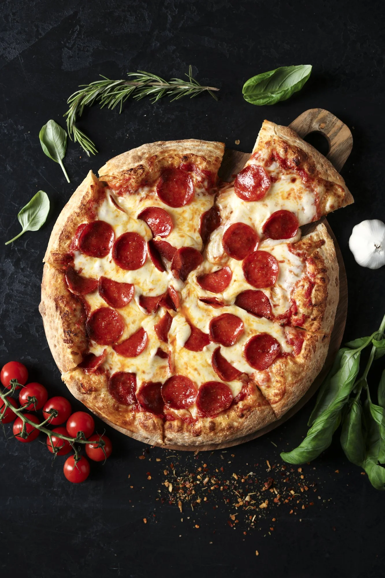pepperoni-pizza-overhead-dark-background.jpg