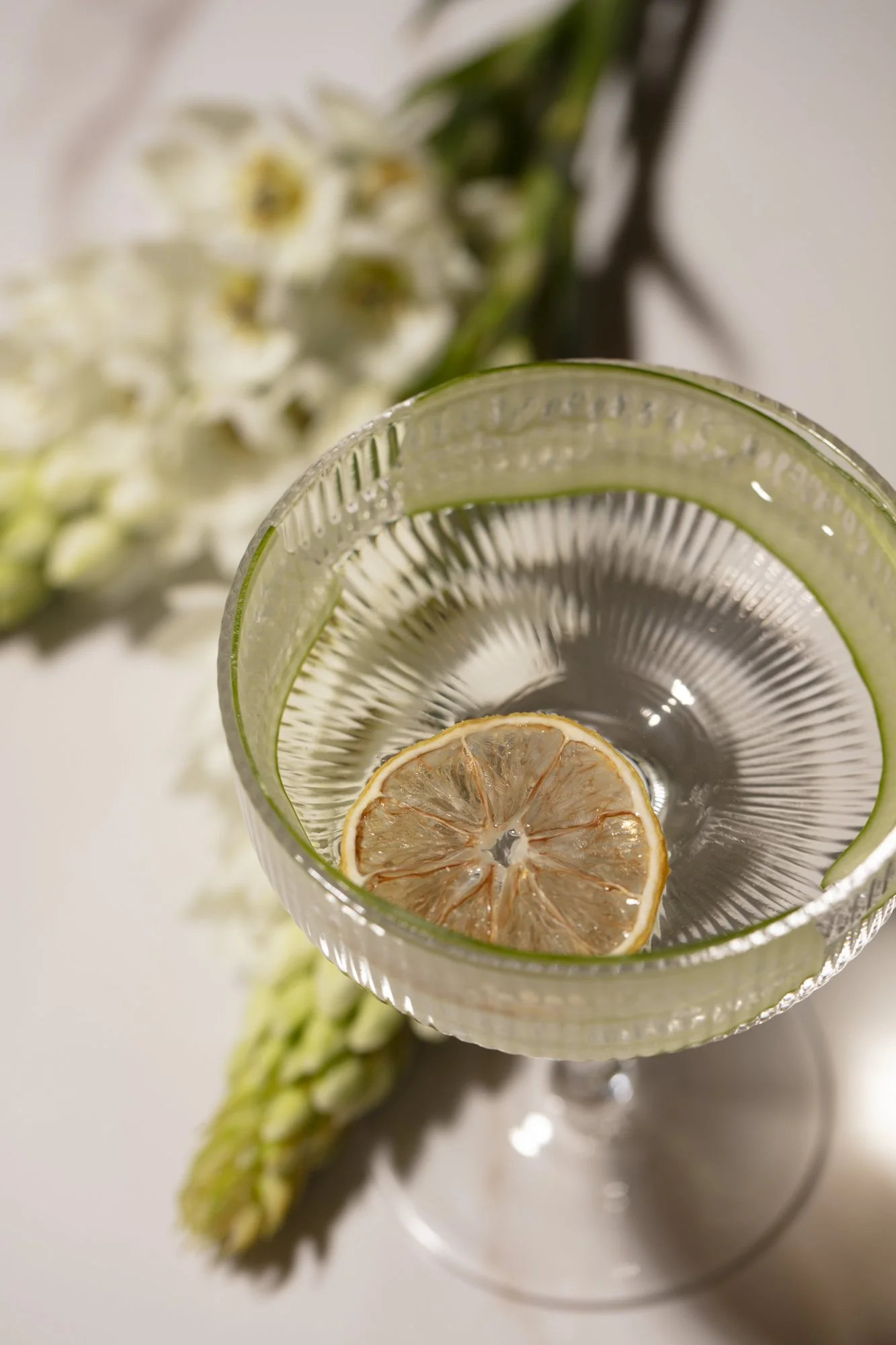 dried-lime-gin-cocktail-coupe-flowers.jpg