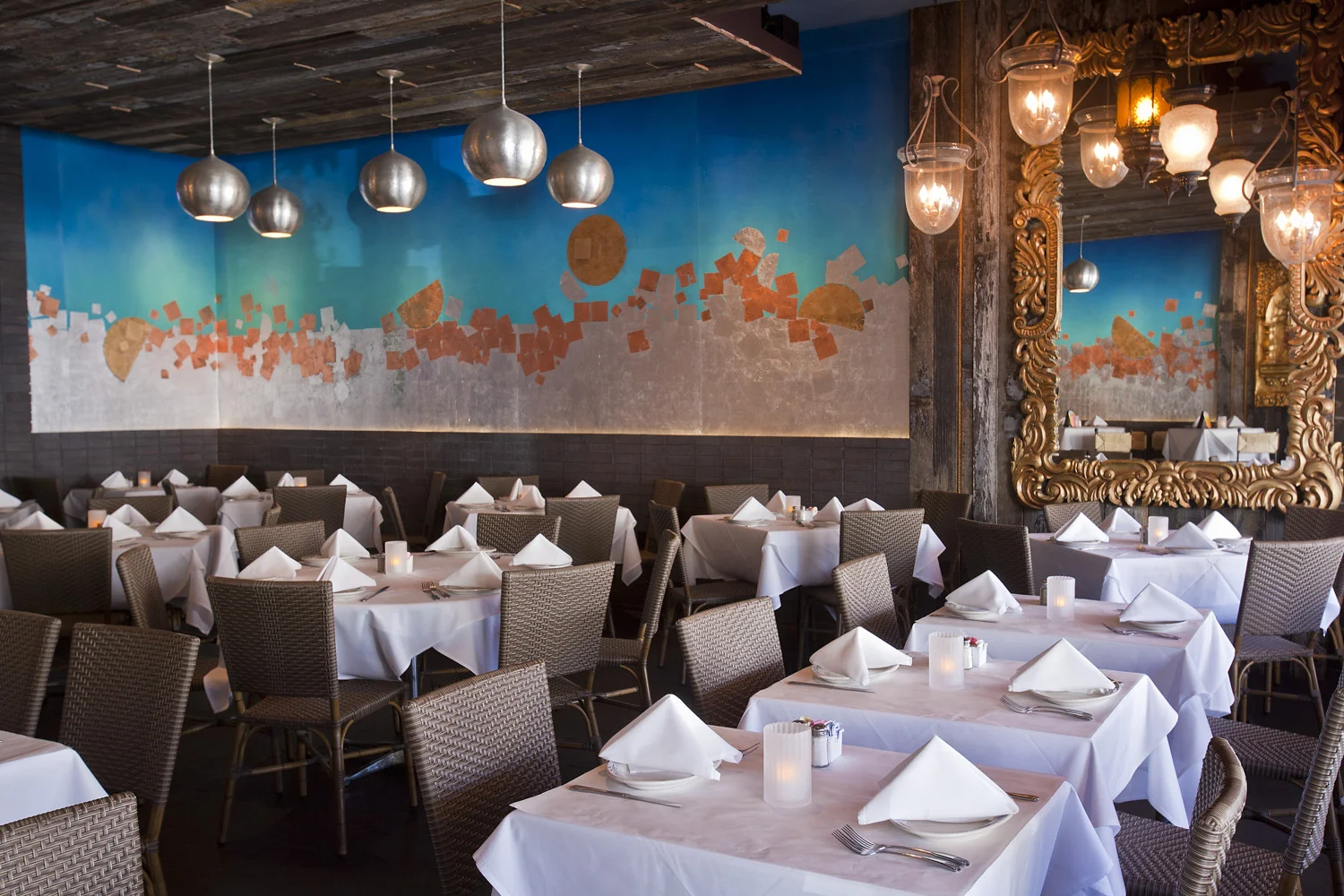 Restaurant dining room with a colorful mural and white tablecloths - restaurant interior photography, Orange CountyRestaurant dining room with a colorful mural and white tablecloths - restaurant interior photography, Orange County