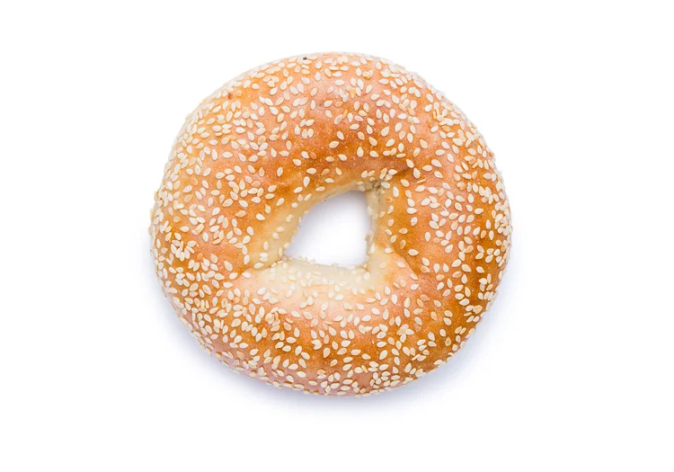 Sesame bagel isolated on white - white background food photography