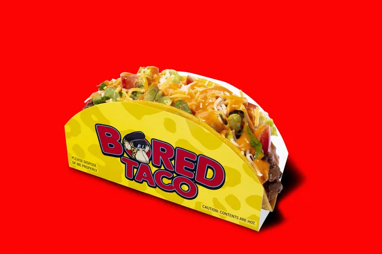Taco in a branded wrapper on a red background - high key advertising food photography