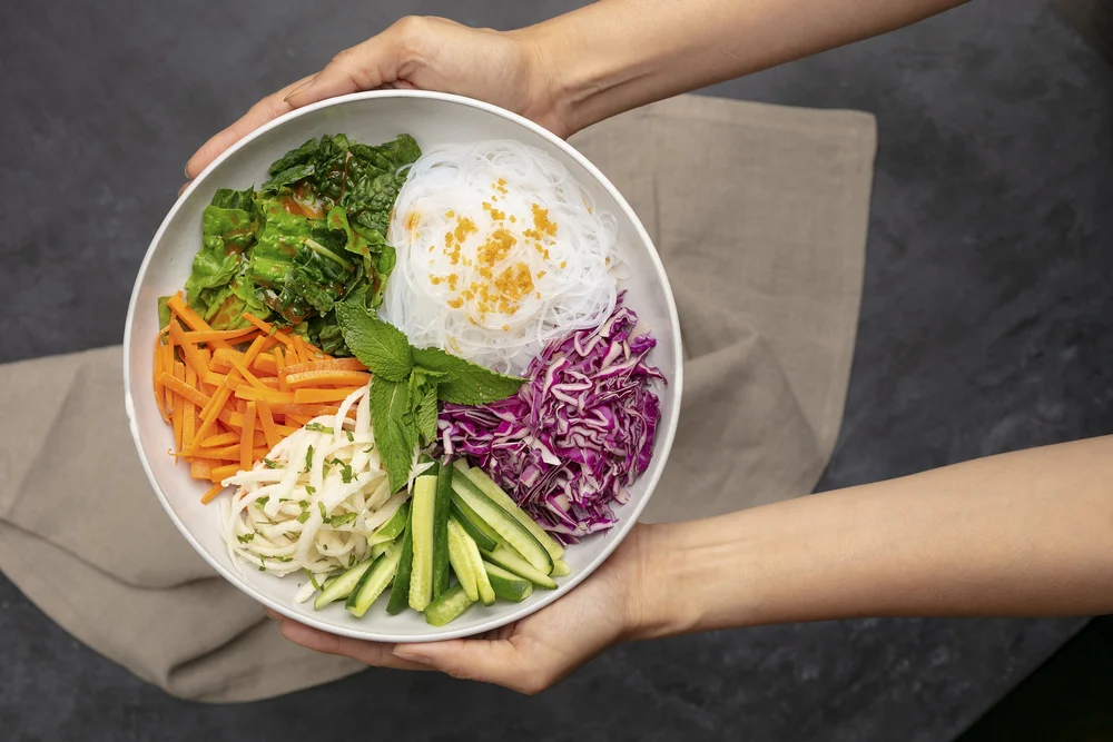 Hands holding a fresh salad bowl, lifestyle food photography Orange County