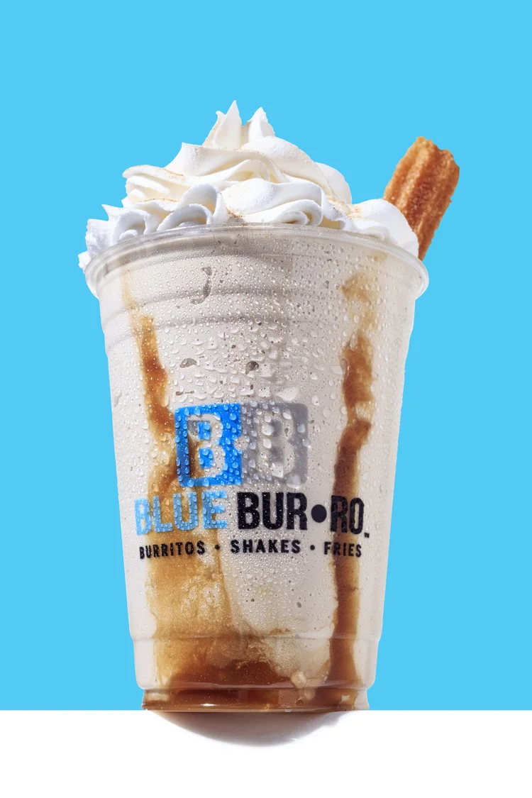 Blue Burro milkshake on a bright blue background - high key food photography