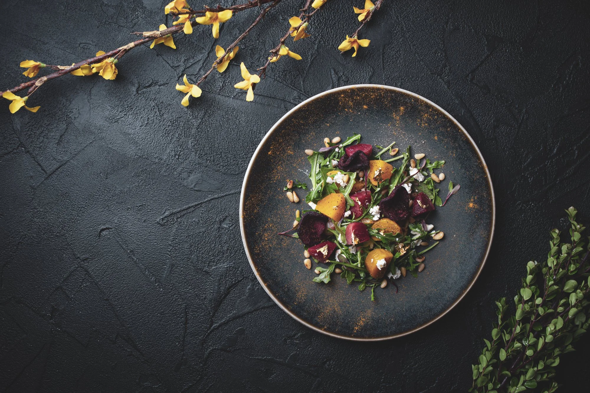 Overhead shot of salad on a black background. Los Angeles food and lifestyle cookbook photographer 