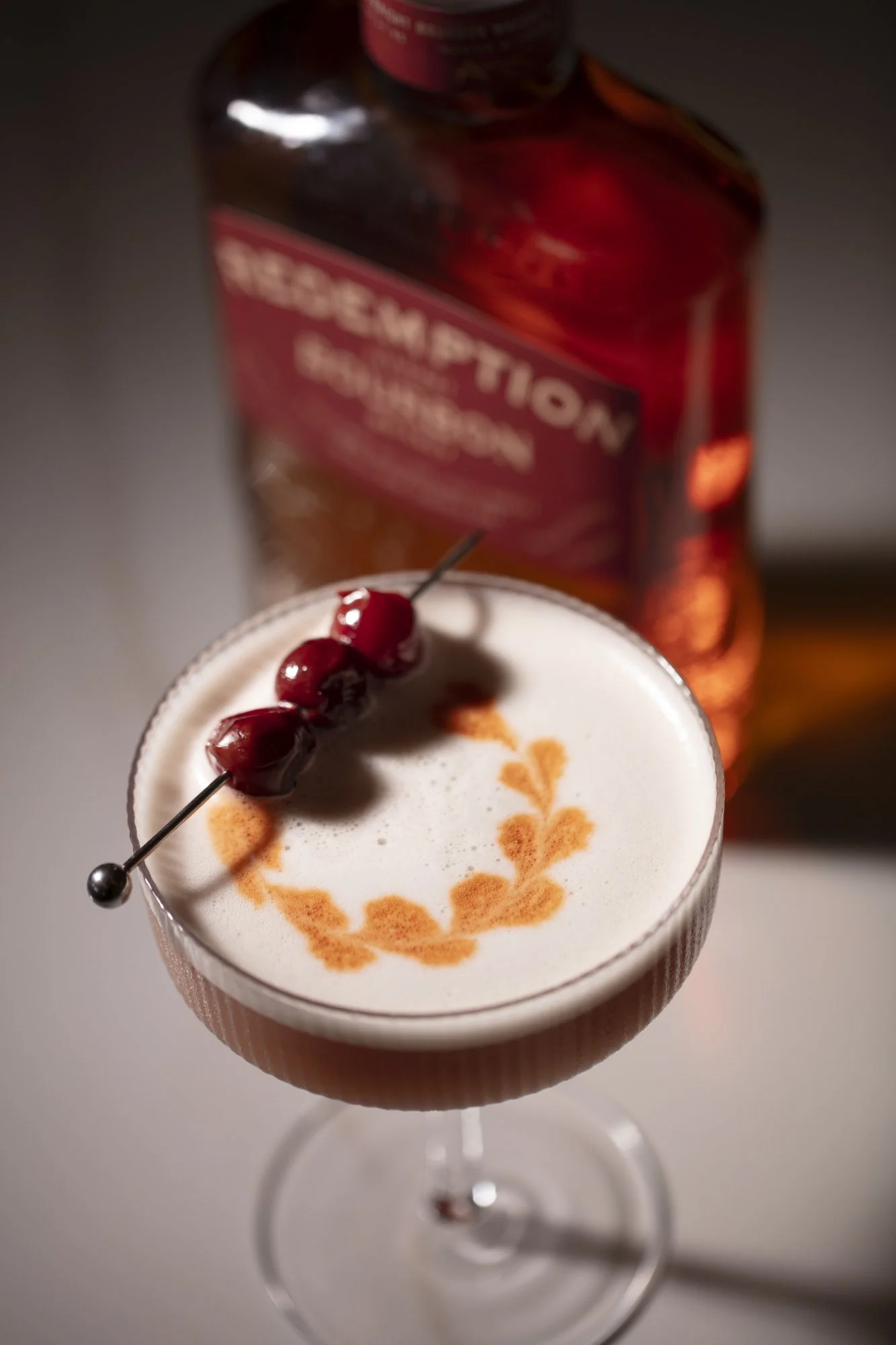 bourbon-sour-cocktail-cherries-latte-art.jpg
