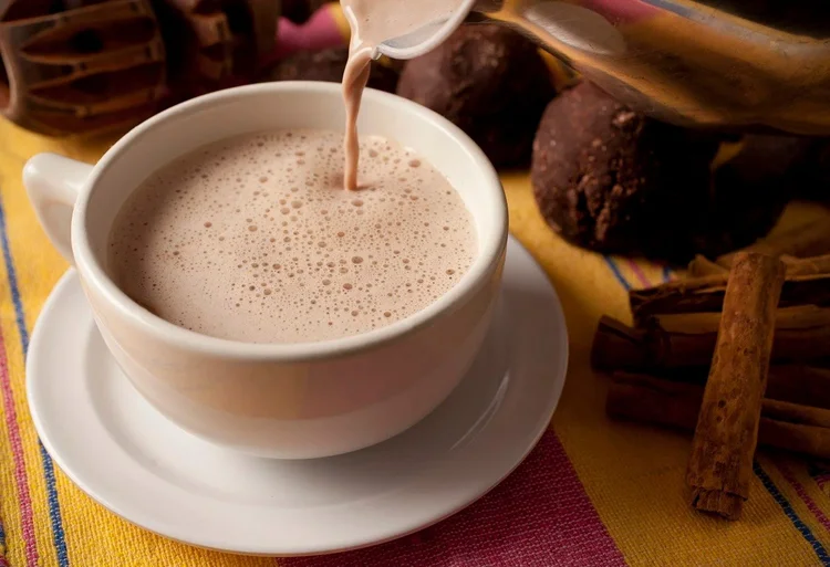 Hot chocolate poured into a white cup - natural light food photography